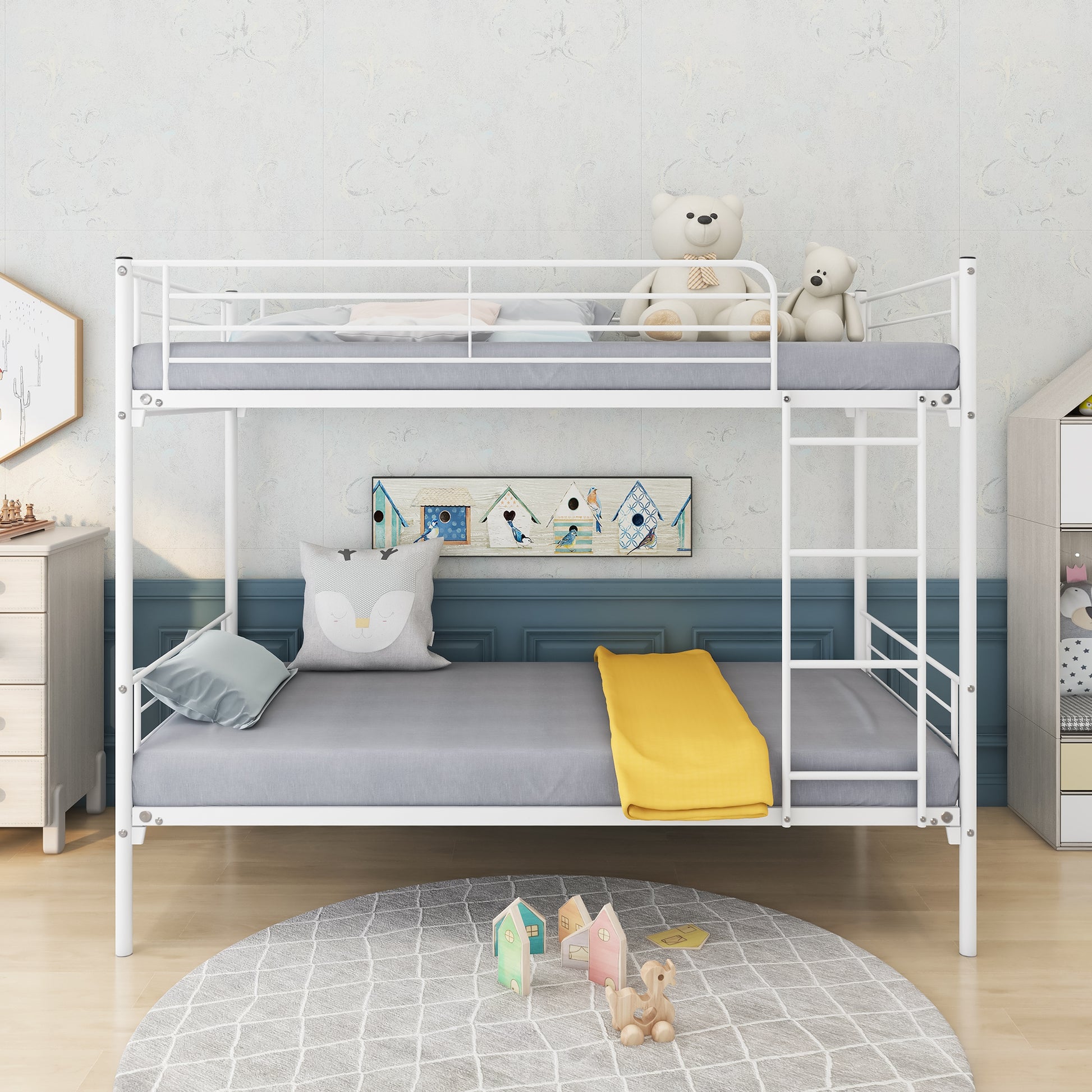 White metal twin bunk bed with grey mattresses and yellow throw