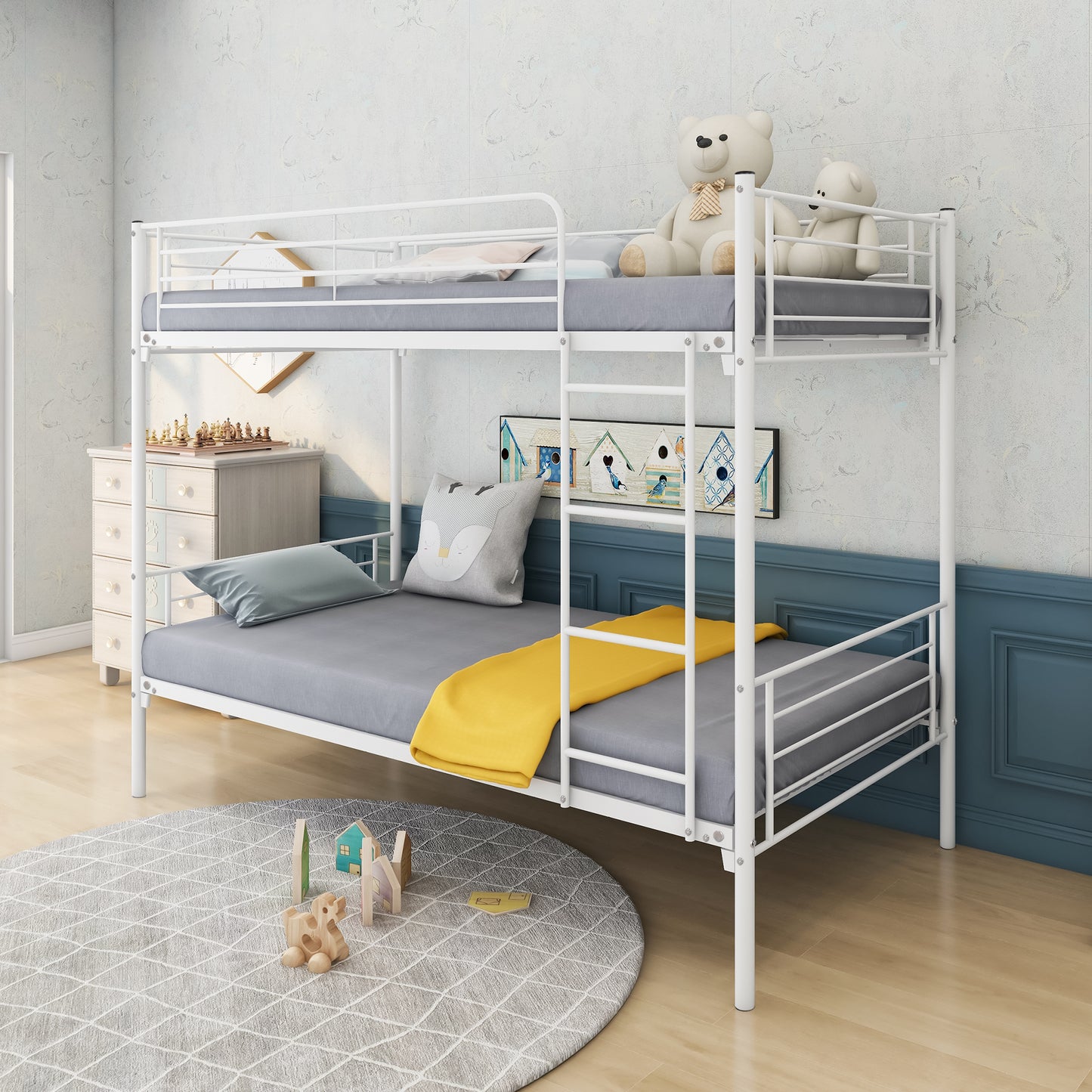 White metal twin bunk bed with grey mattresses and yellow throw