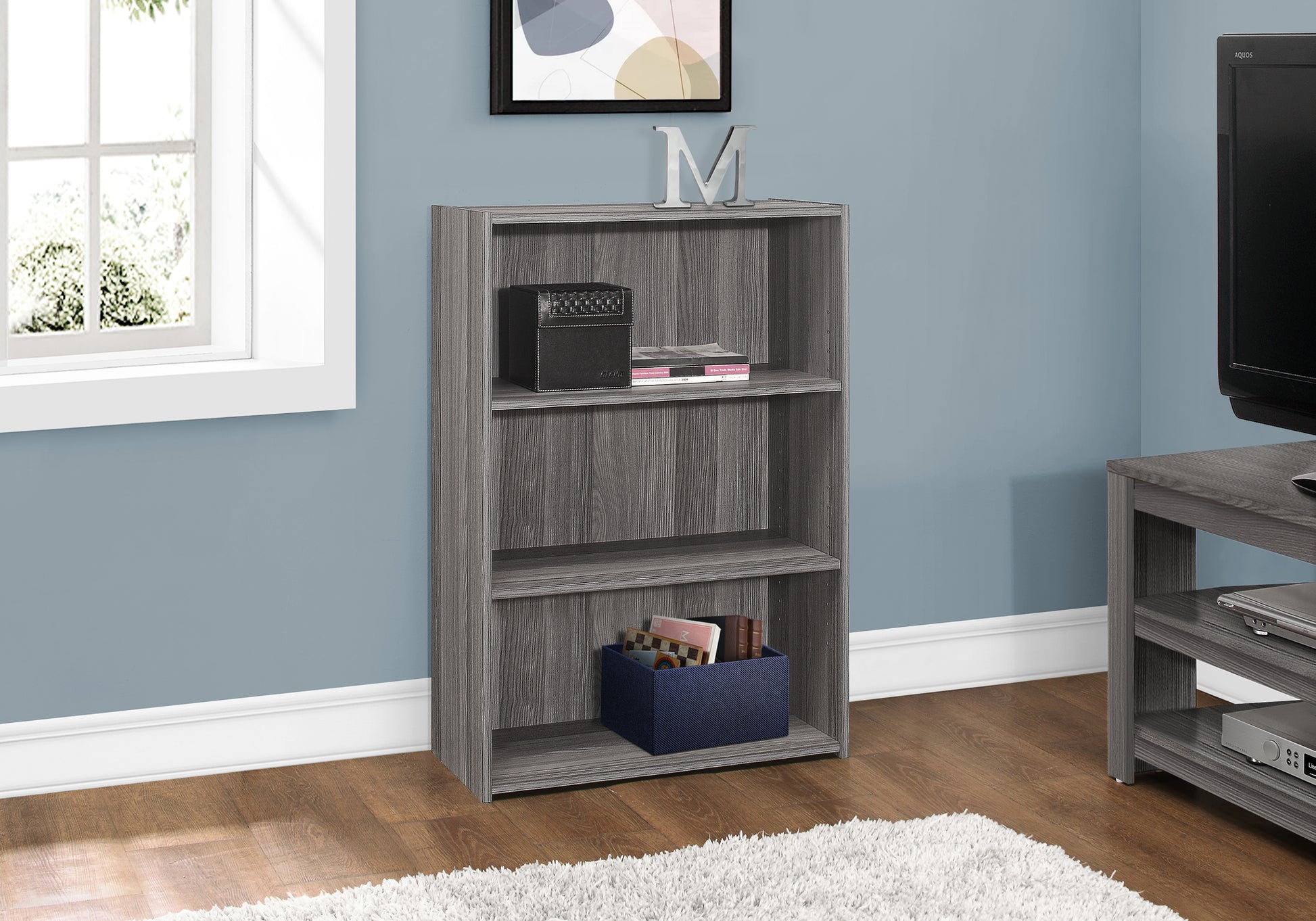 Gray wood veneer bookcase with three shelves