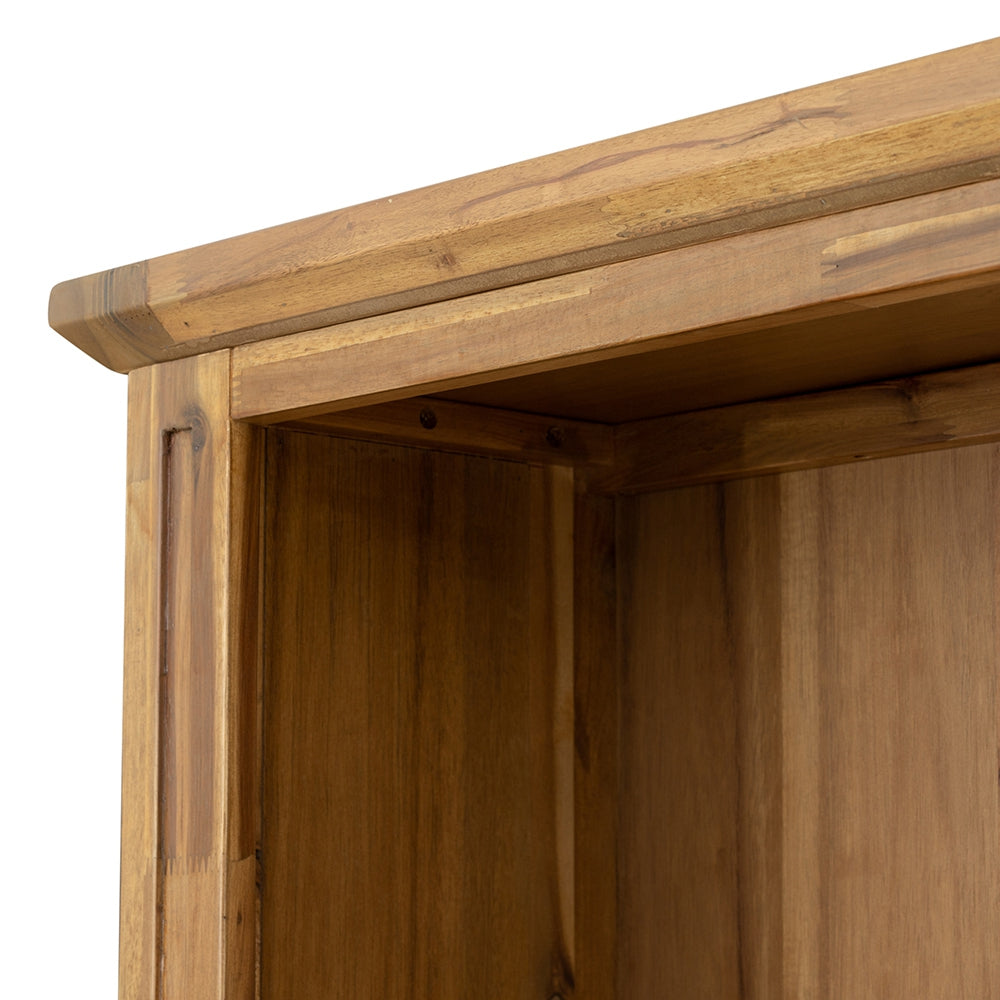 Closeup of a solid wood bookshelf top edge in a warm brown tone