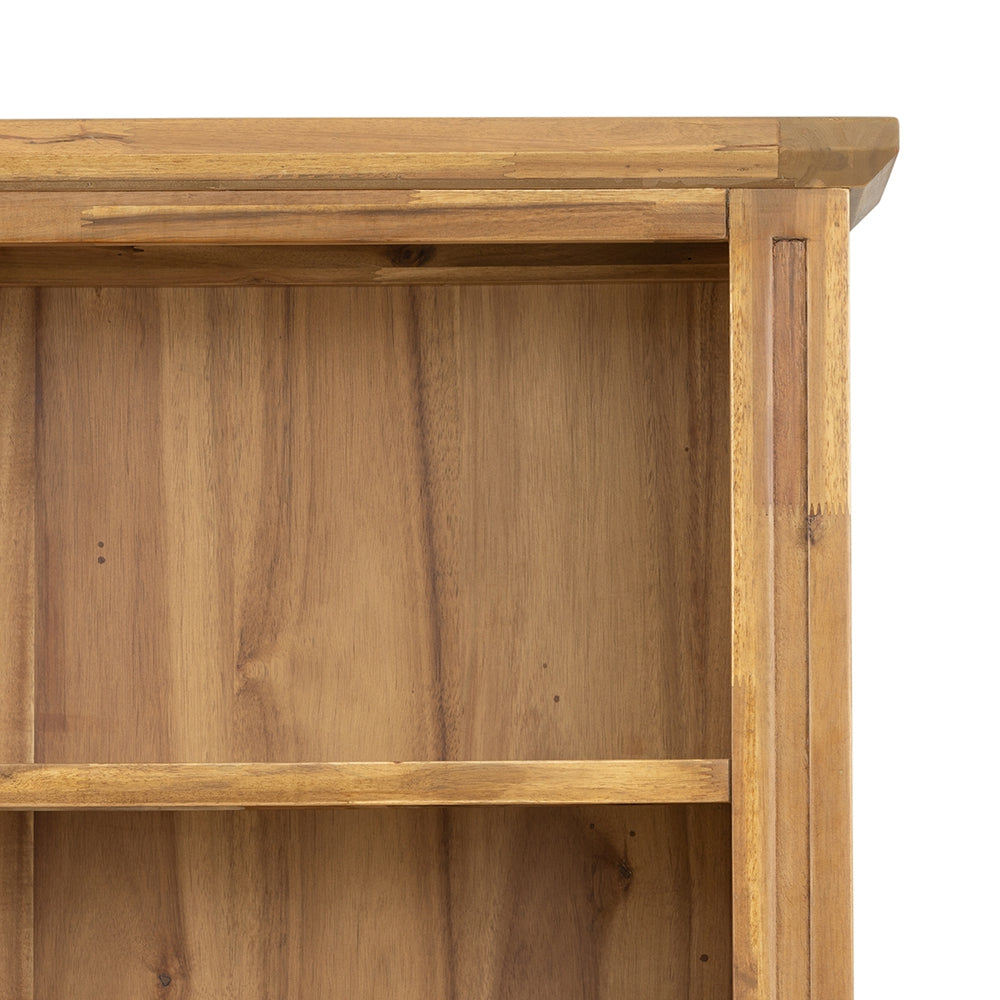 Corner view of a warmtoned solid wood bookcase shelf