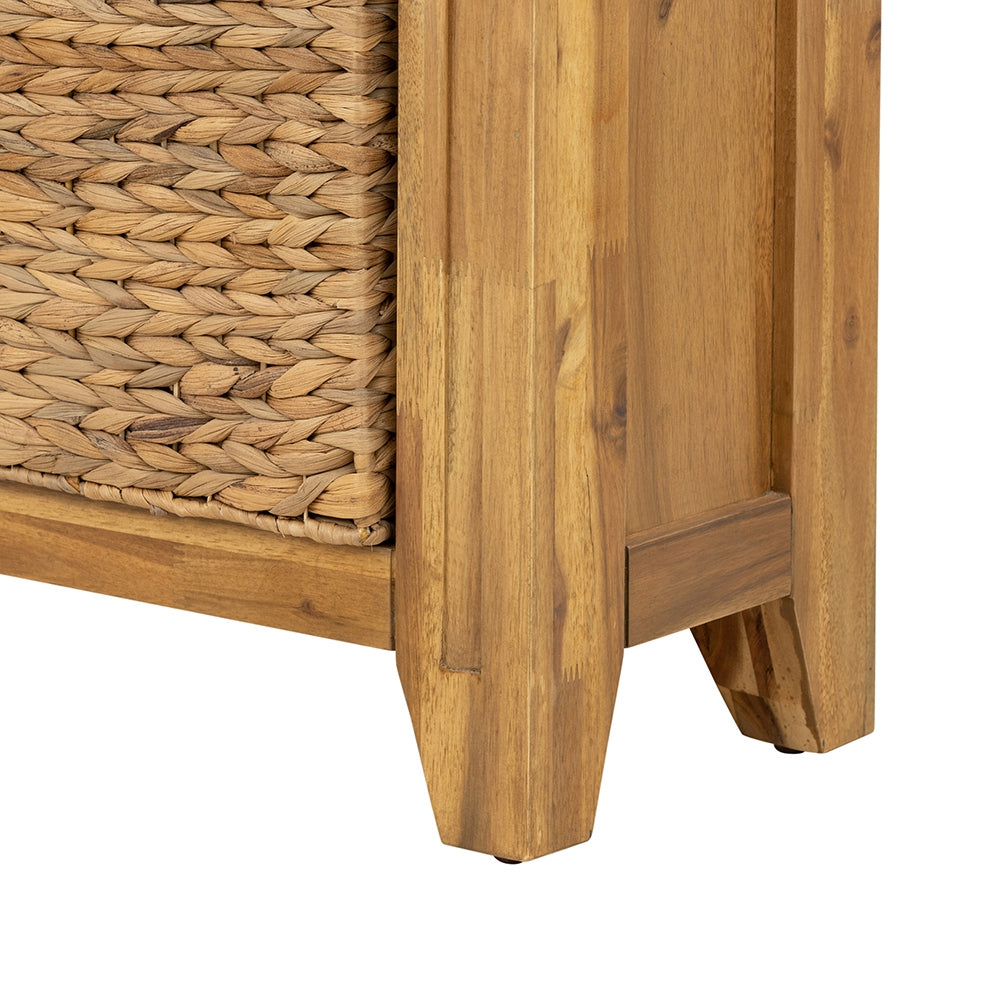 Closeup of woven hyacinth basket on a wooden side table