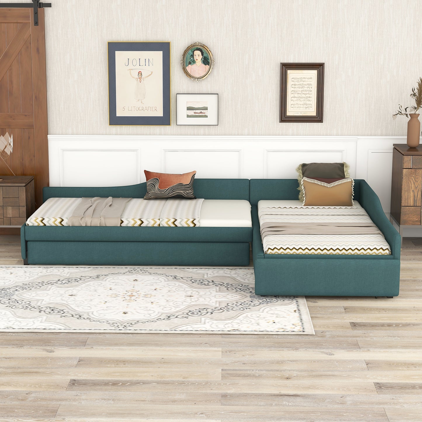 Teal fabric sectional sofa bed with patterned cushions and throw blankets