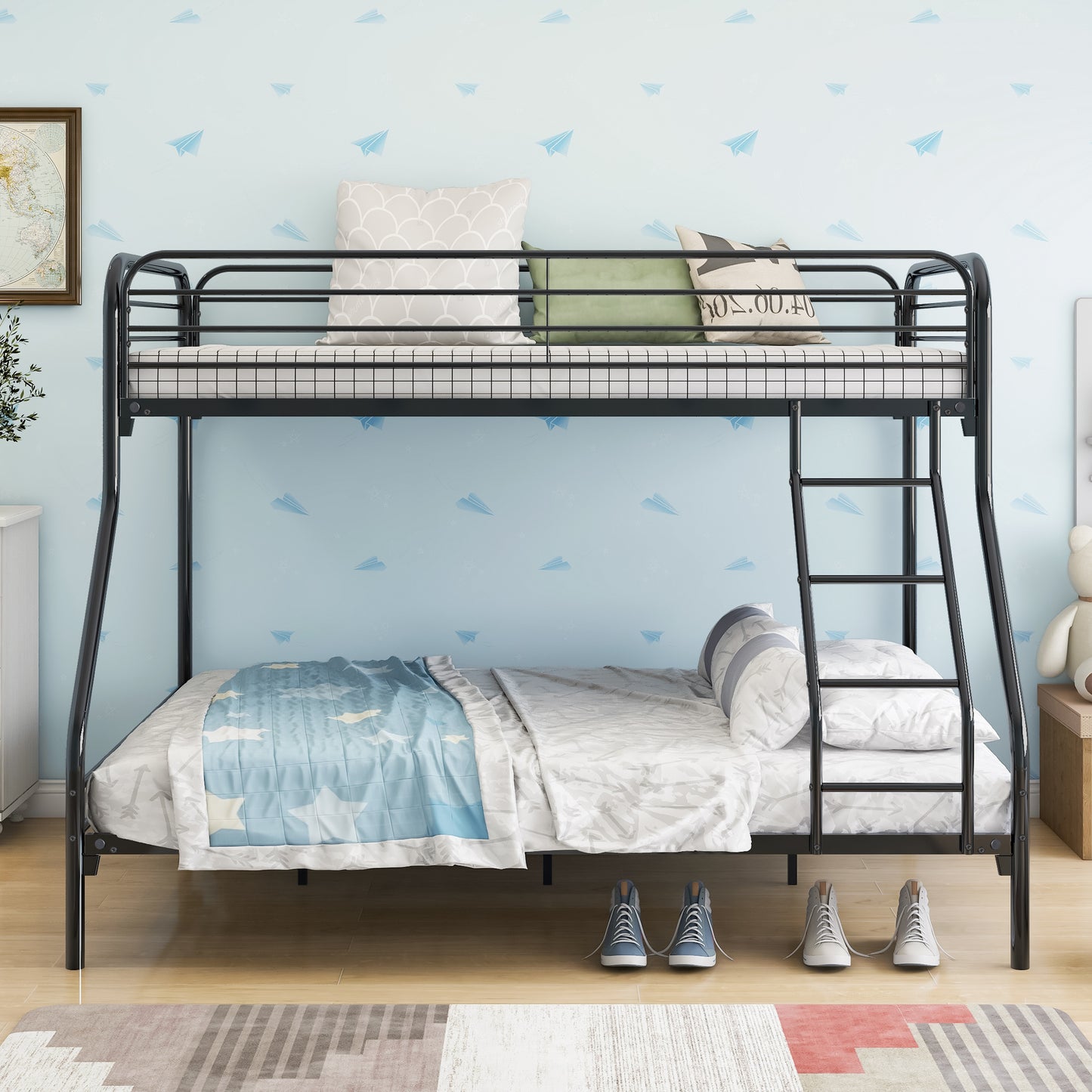 Black metal triple bunk bed with white mattress and plaid bedding