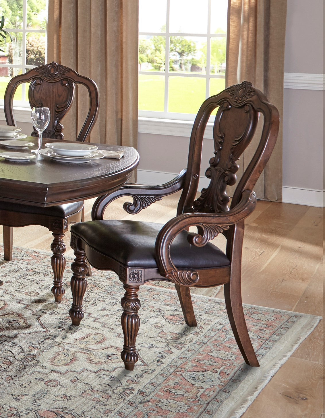 Ornate dark wood dining chair with upholstered seat