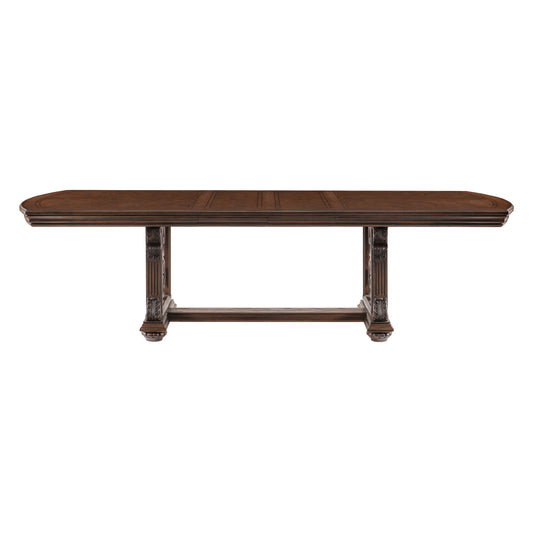 Ornate dark wood dining table with carved pedestal legs