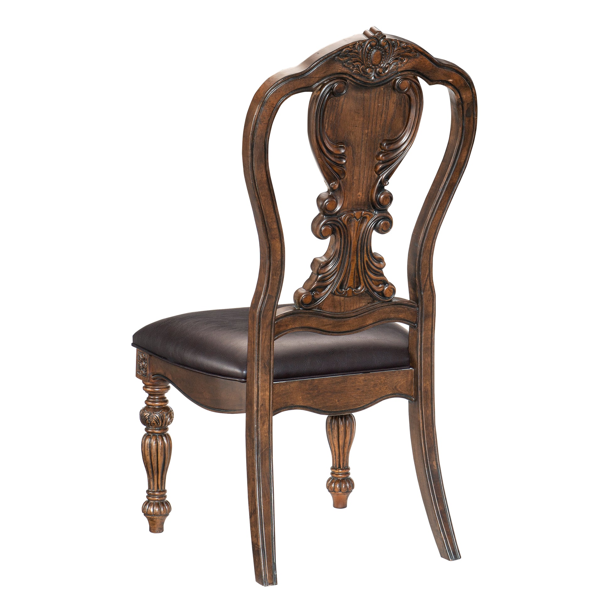 Antique brown dining chair with ornate carvings and dark leather seat
