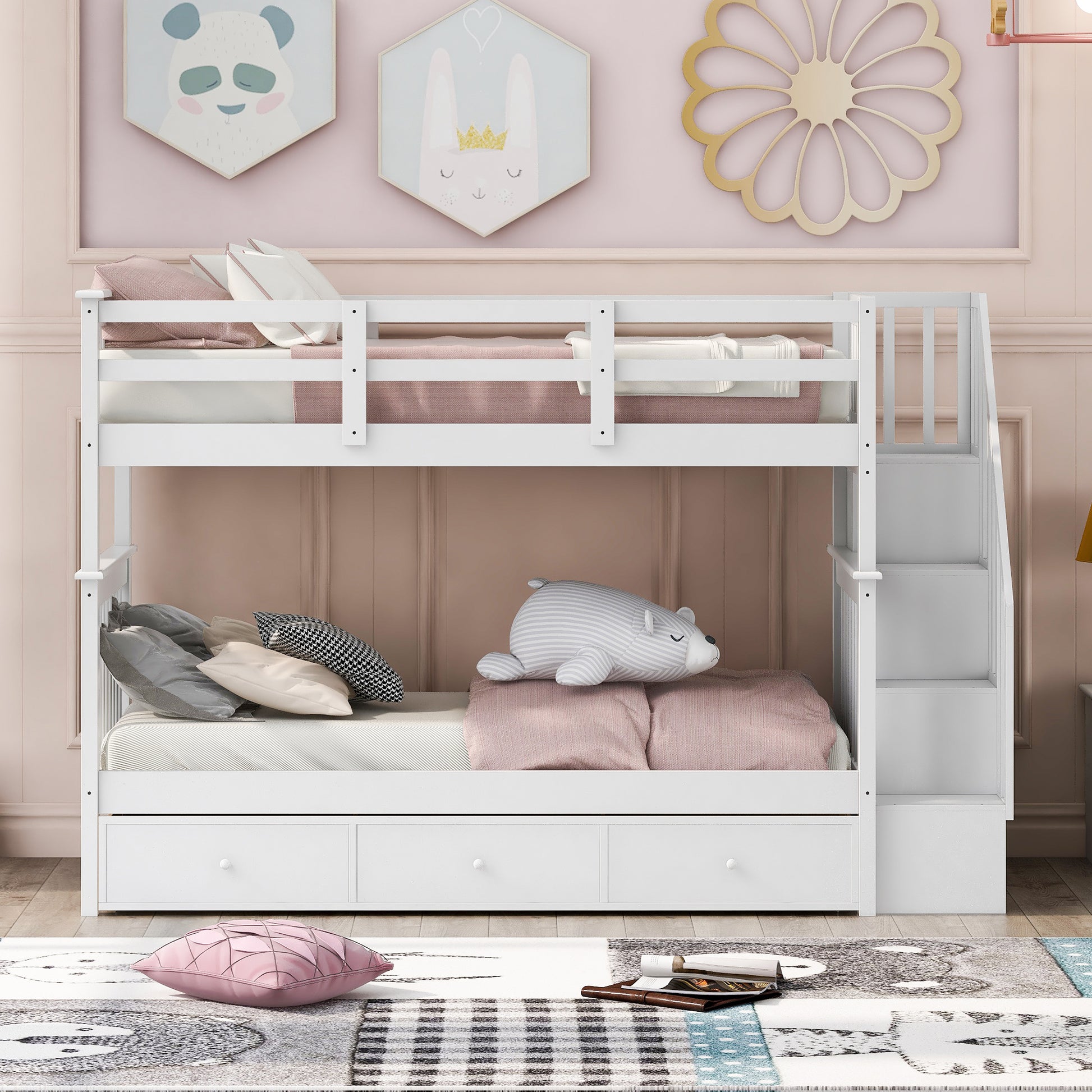 White wooden twin over twin bunk bed with trundle and storage drawers