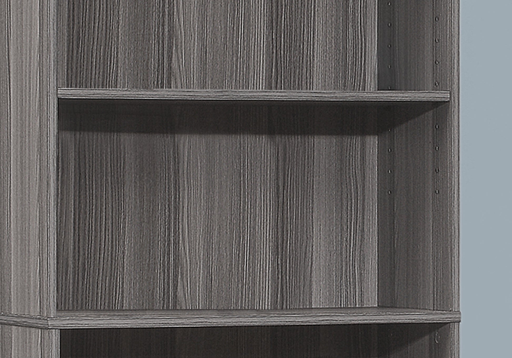 Gray wood grain tall bookshelf with adjustable shelves