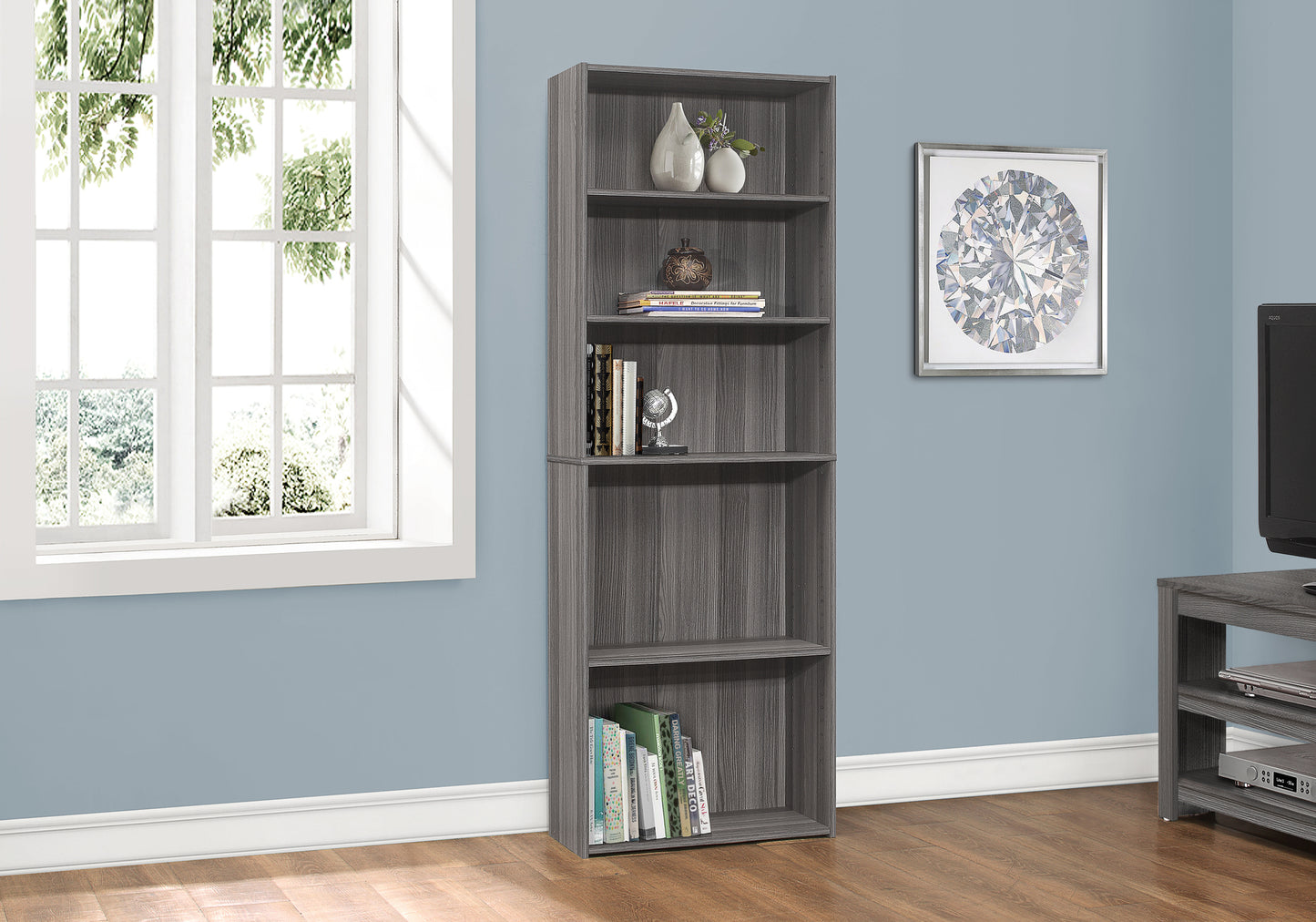 Tall gray wood bookshelf with five shelves for home organization