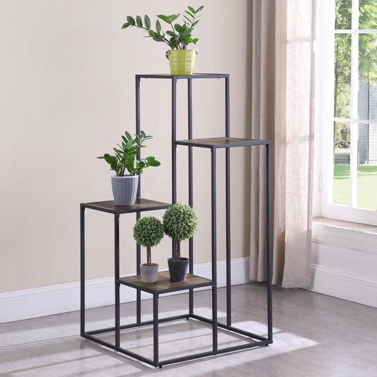 Metal plant stand with tiered shelves holding potted plants