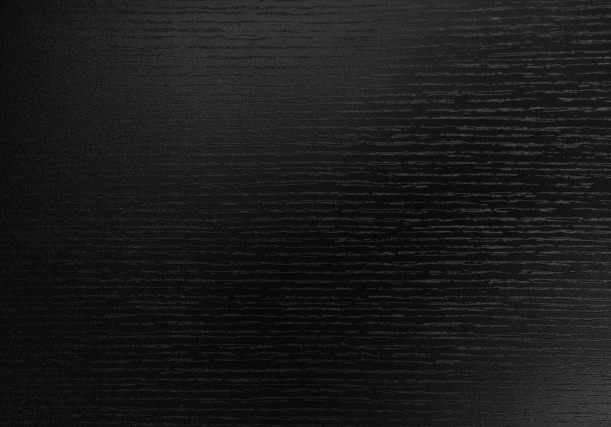 Closeup of textured black wood grain