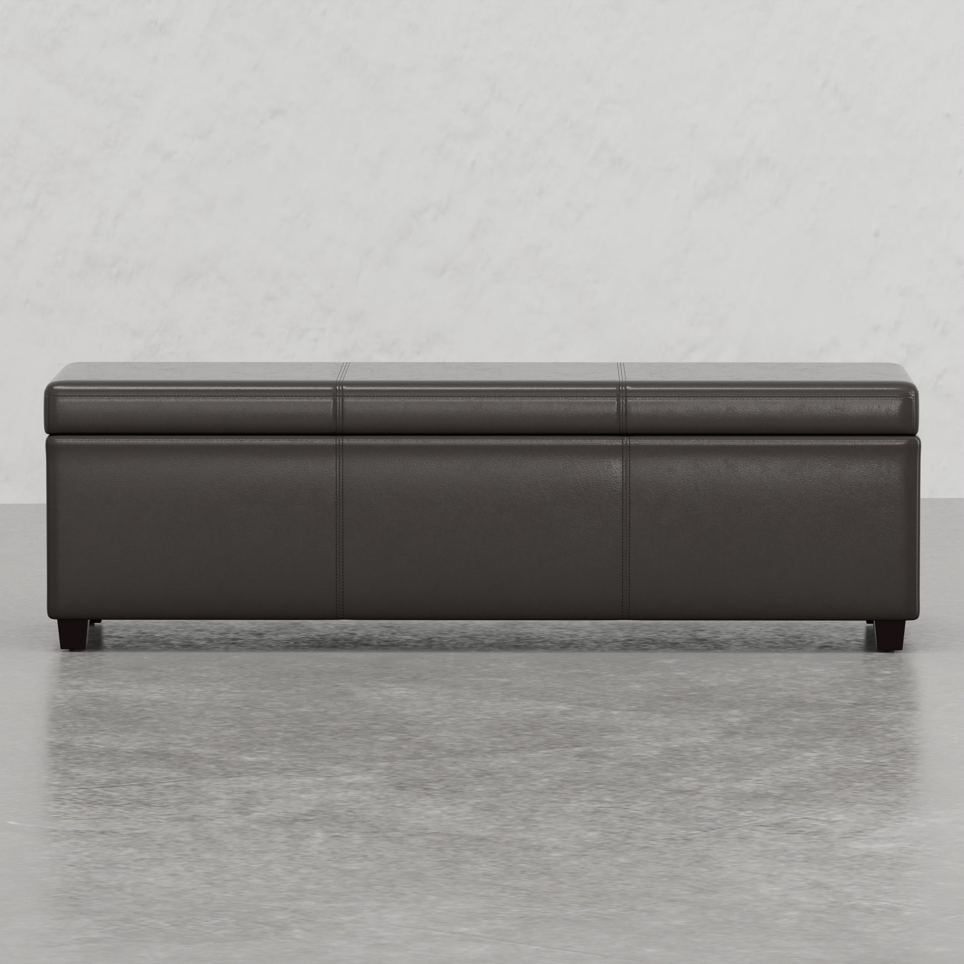 Dark brown leather storage ottoman with button tufted top and wooden legs