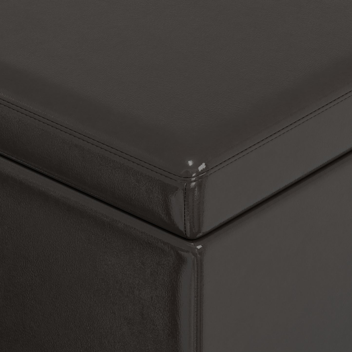 Dark grey faux leather storage ottoman with subtle stitching detail
