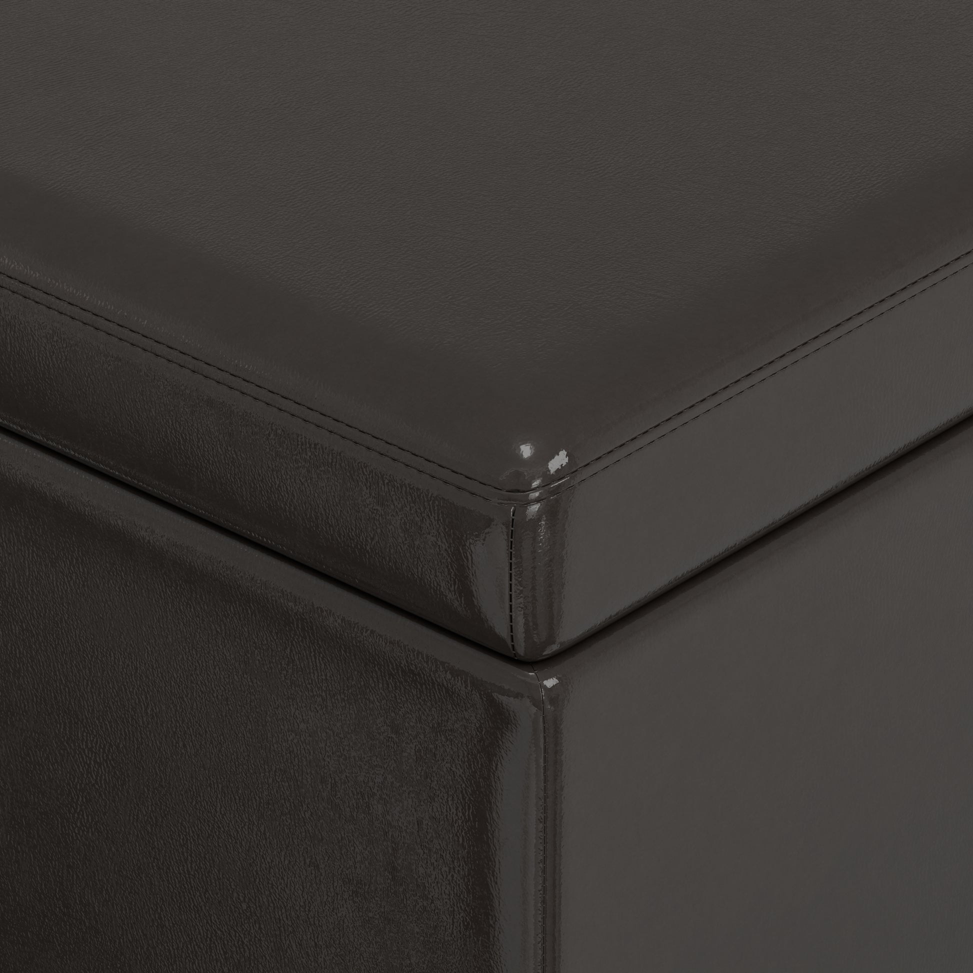 Dark grey faux leather storage ottoman with subtle stitching detail