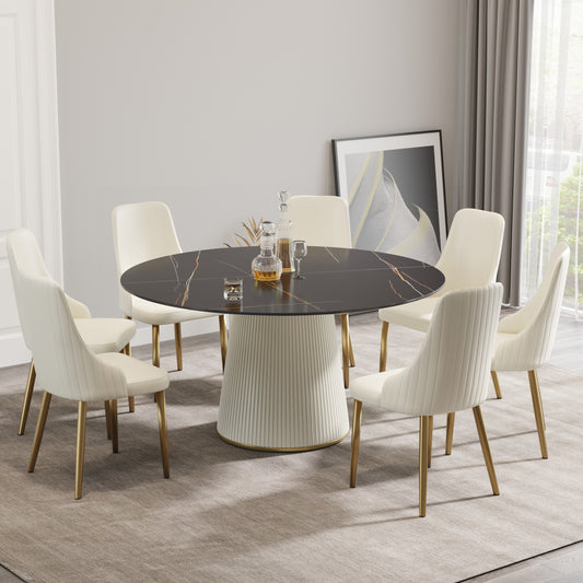 Black marble dining table with fluted pedestal base and six cream velvet chairs