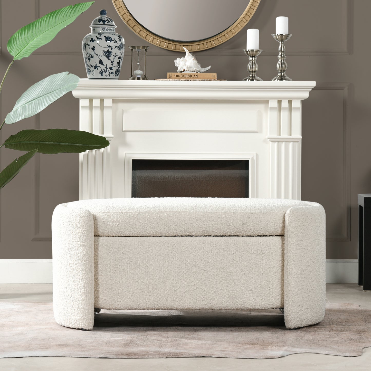 Plush boucle fabric storage ottoman in cream with curved arms and hidden storage