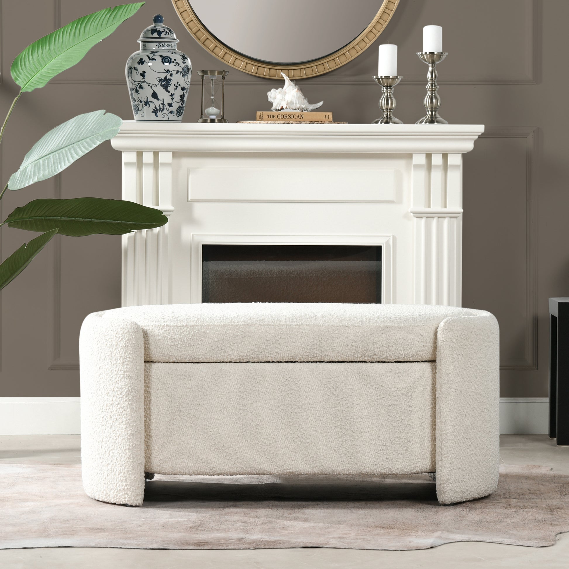 Plush boucle fabric storage ottoman in cream with curved arms and hidden storage