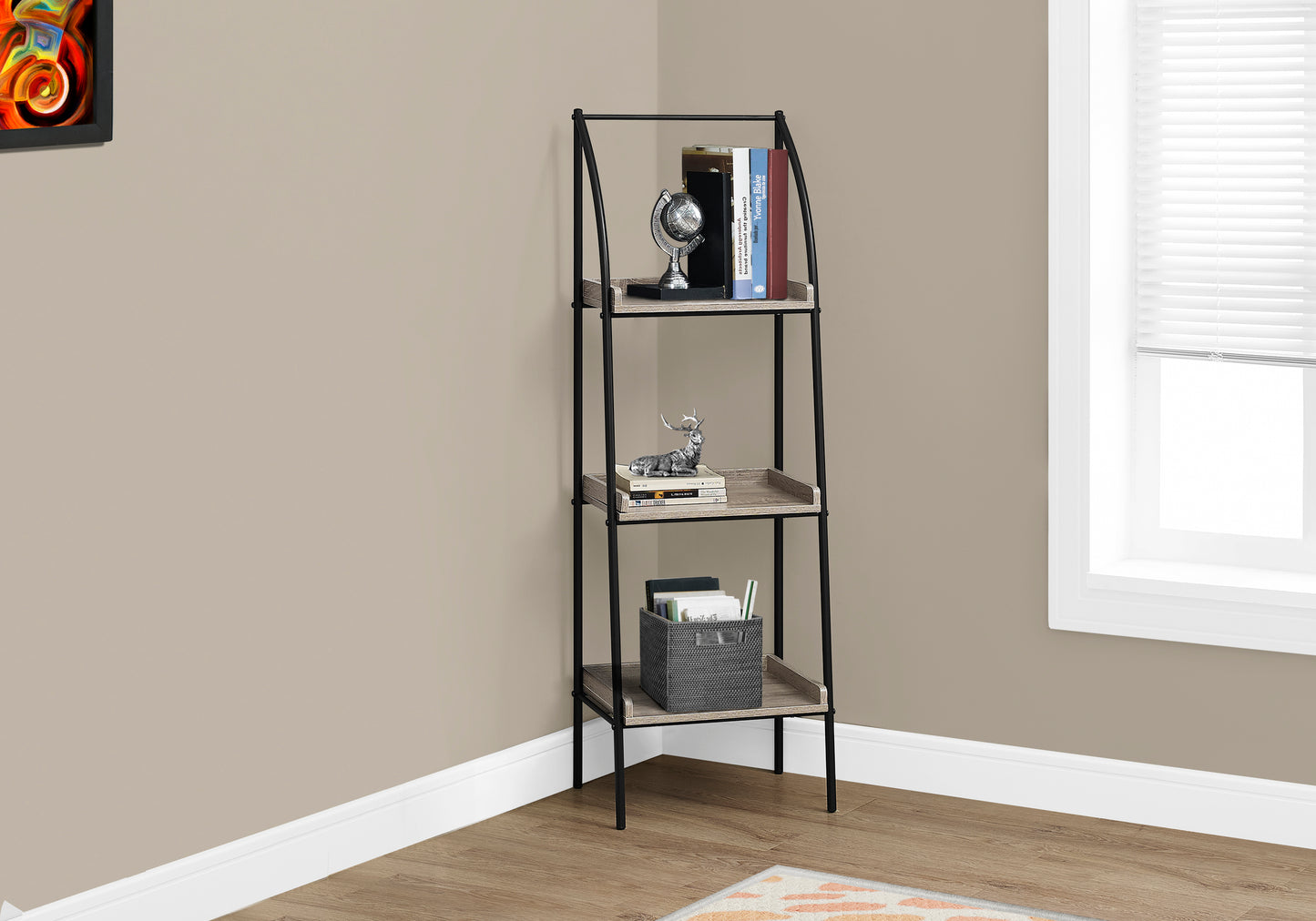 Black metal and wood ladder shelf with globe and books