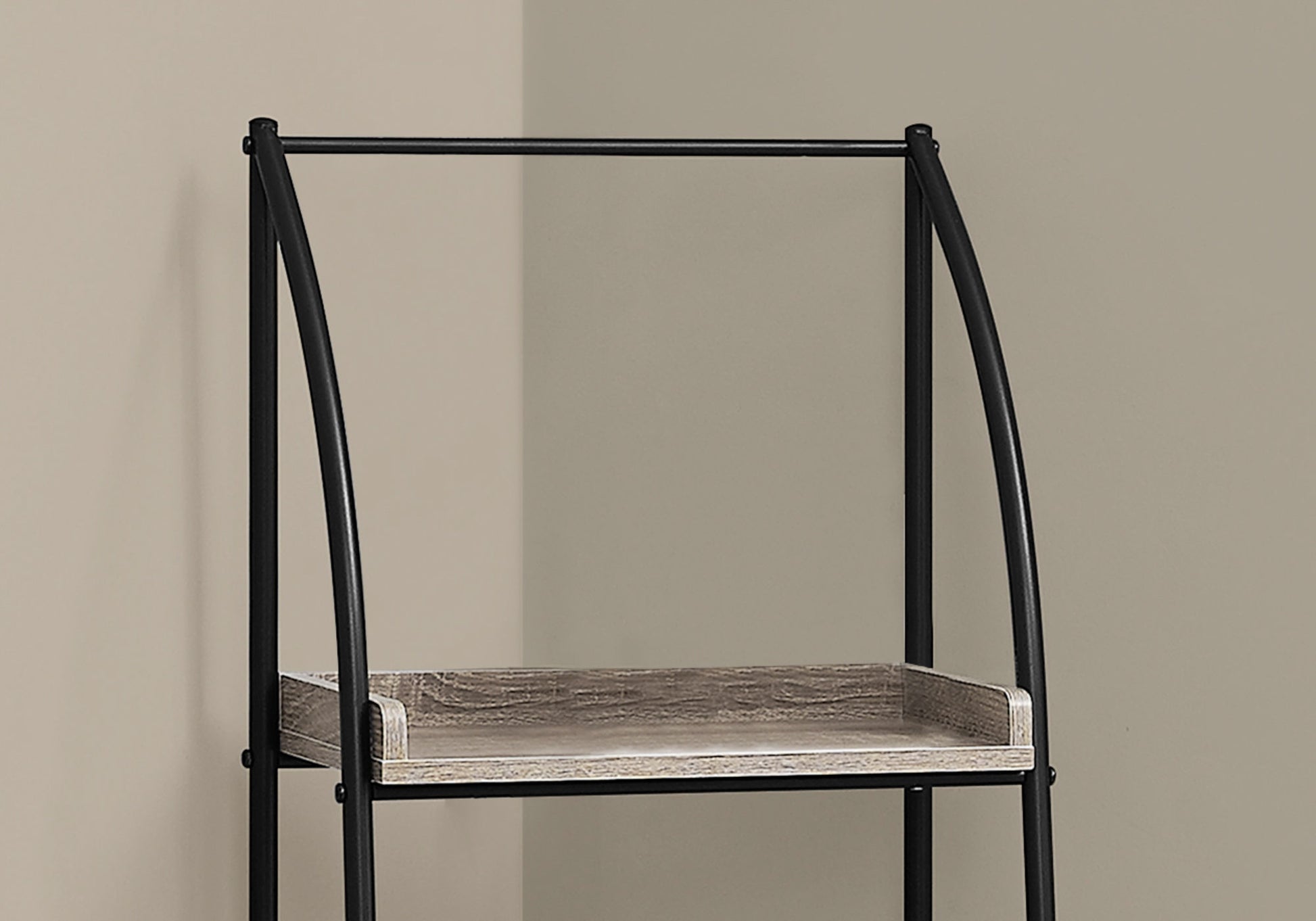 Black metal framed ladder shelf with distressed wood shelves