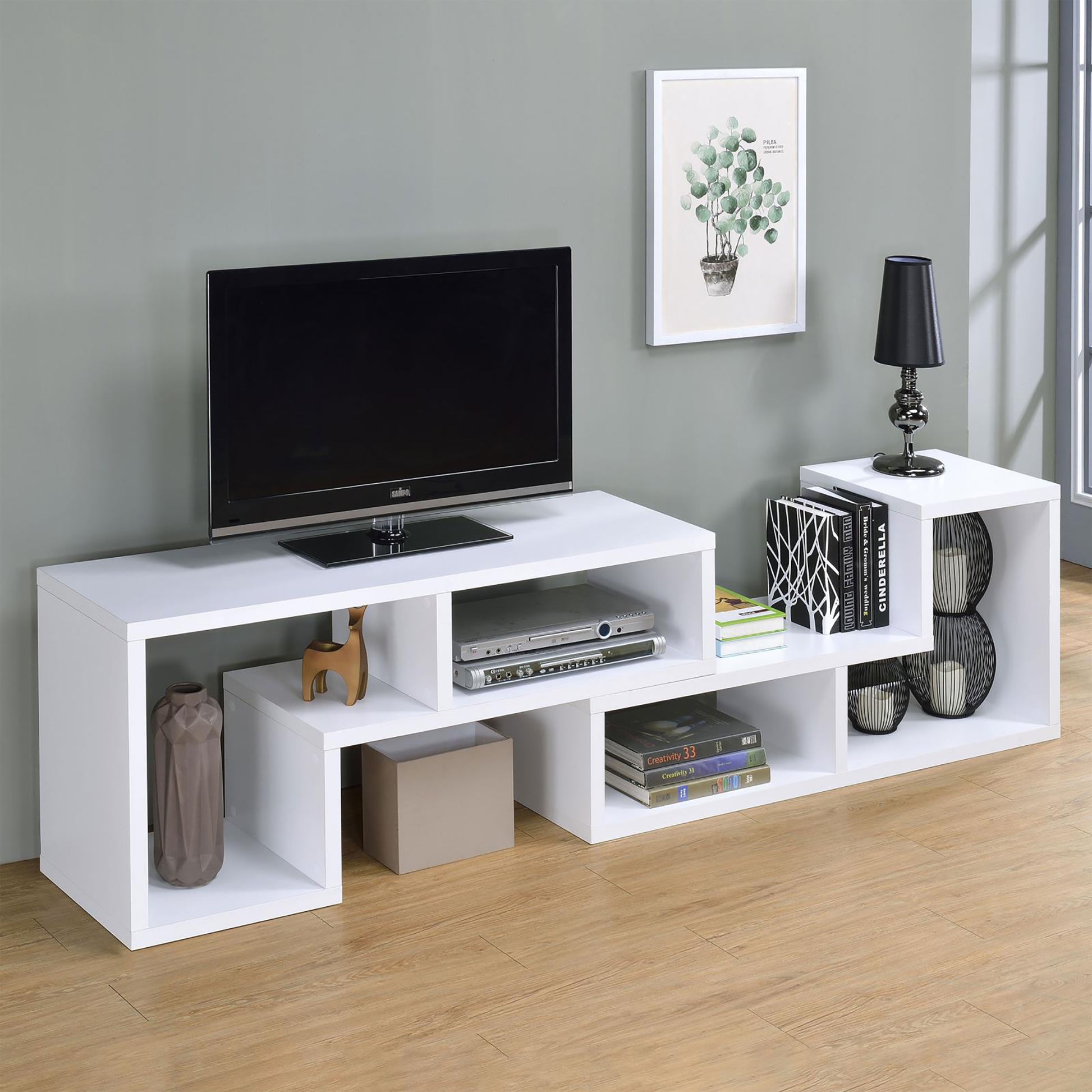 Sleek white modern media console with integrated shelving for electronics and decor