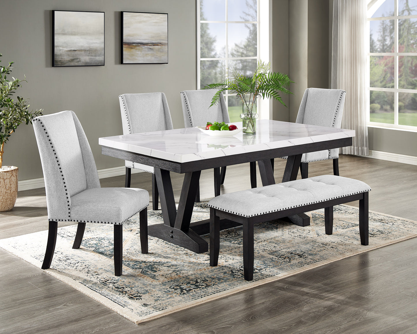 Gray upholstered dining chair with studded trim