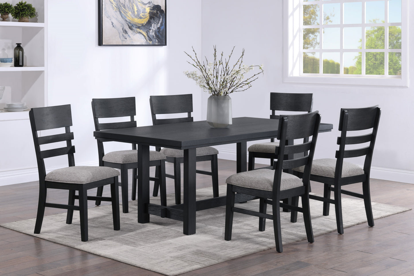 Black wood dining table and six upholstered chairs with gray fabric seats