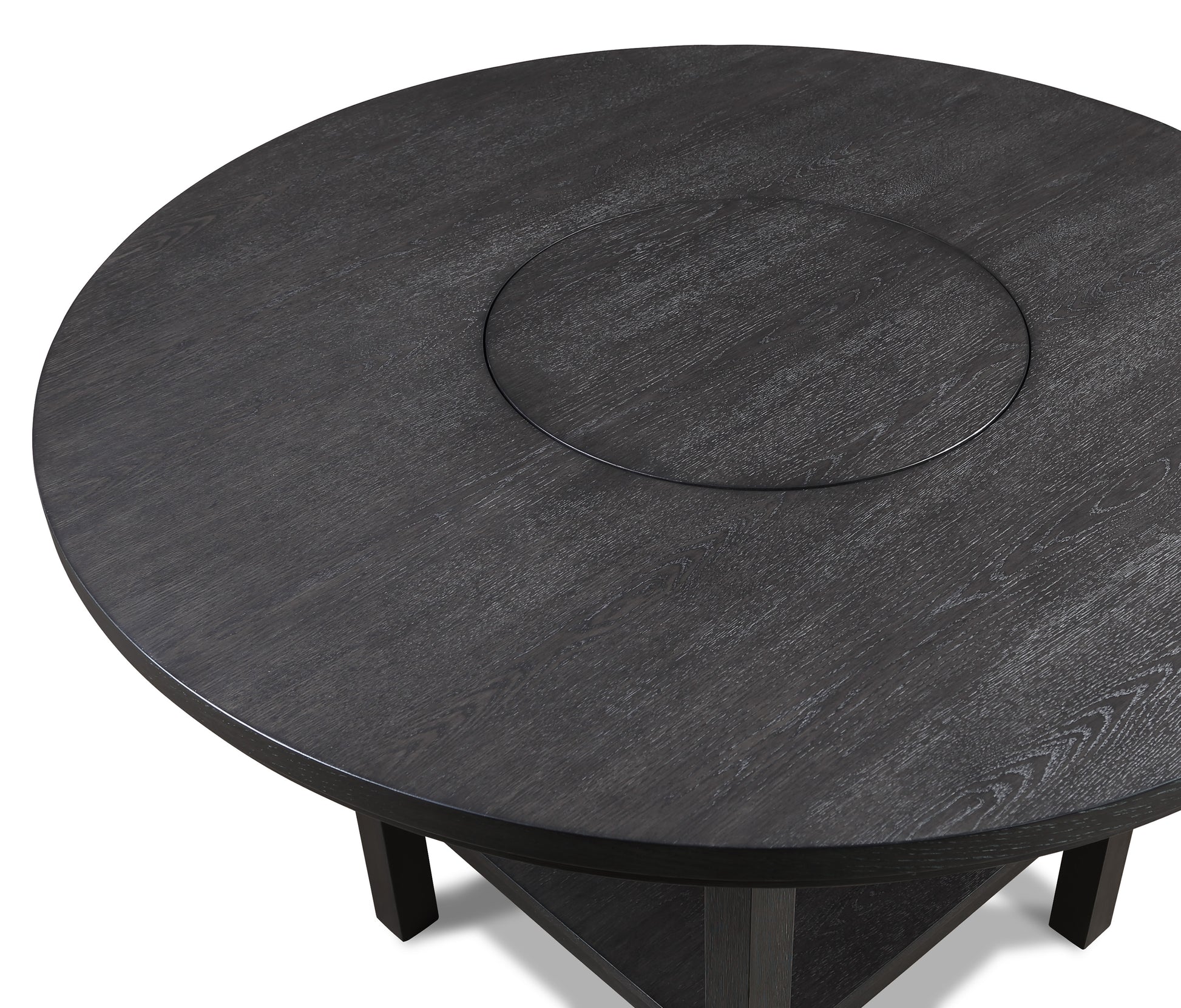 Dark oak round dining table with visible wood grain texture and central inset