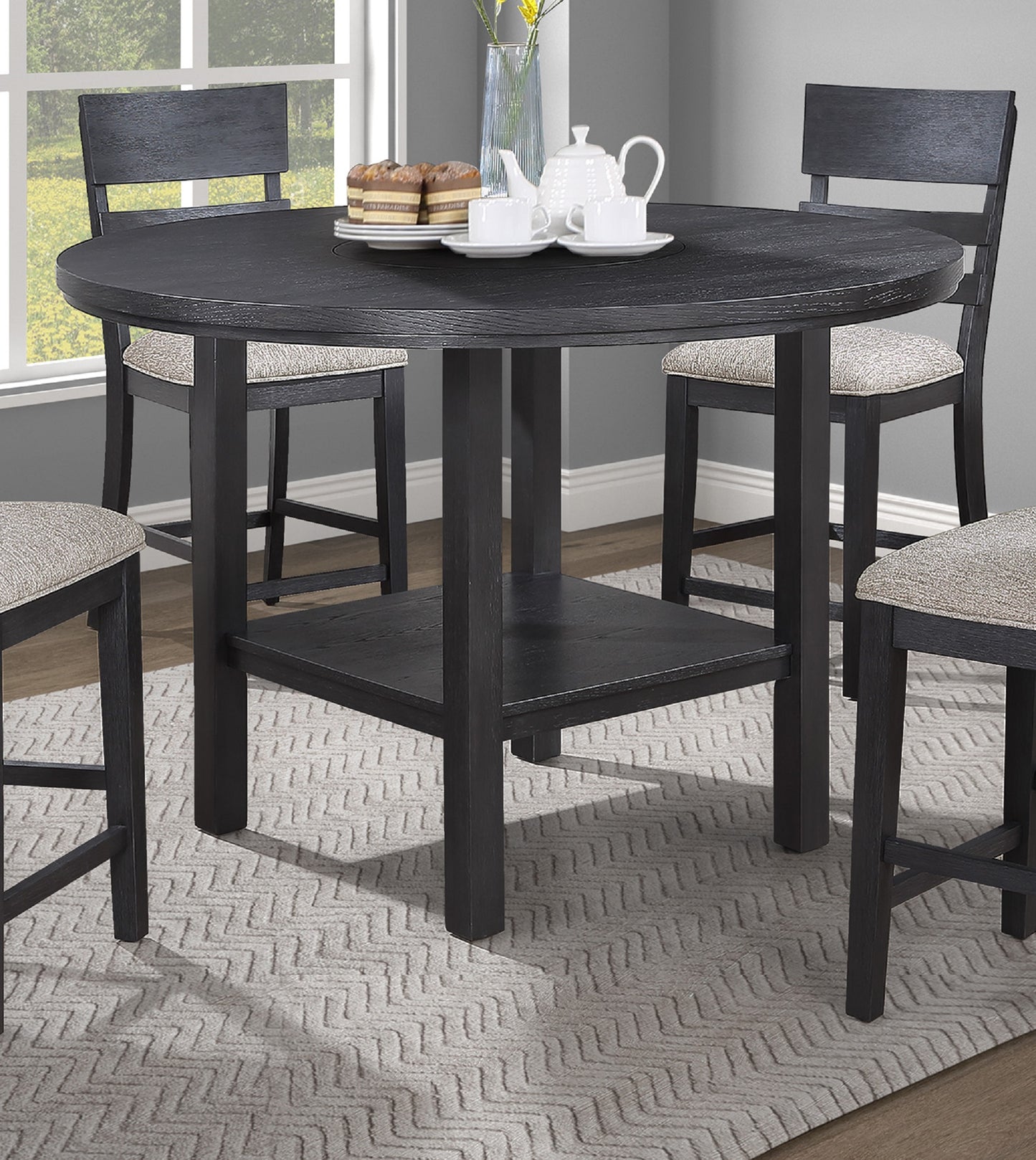 Dark gray round counterheight dining table with wood grain texture and four matching stools