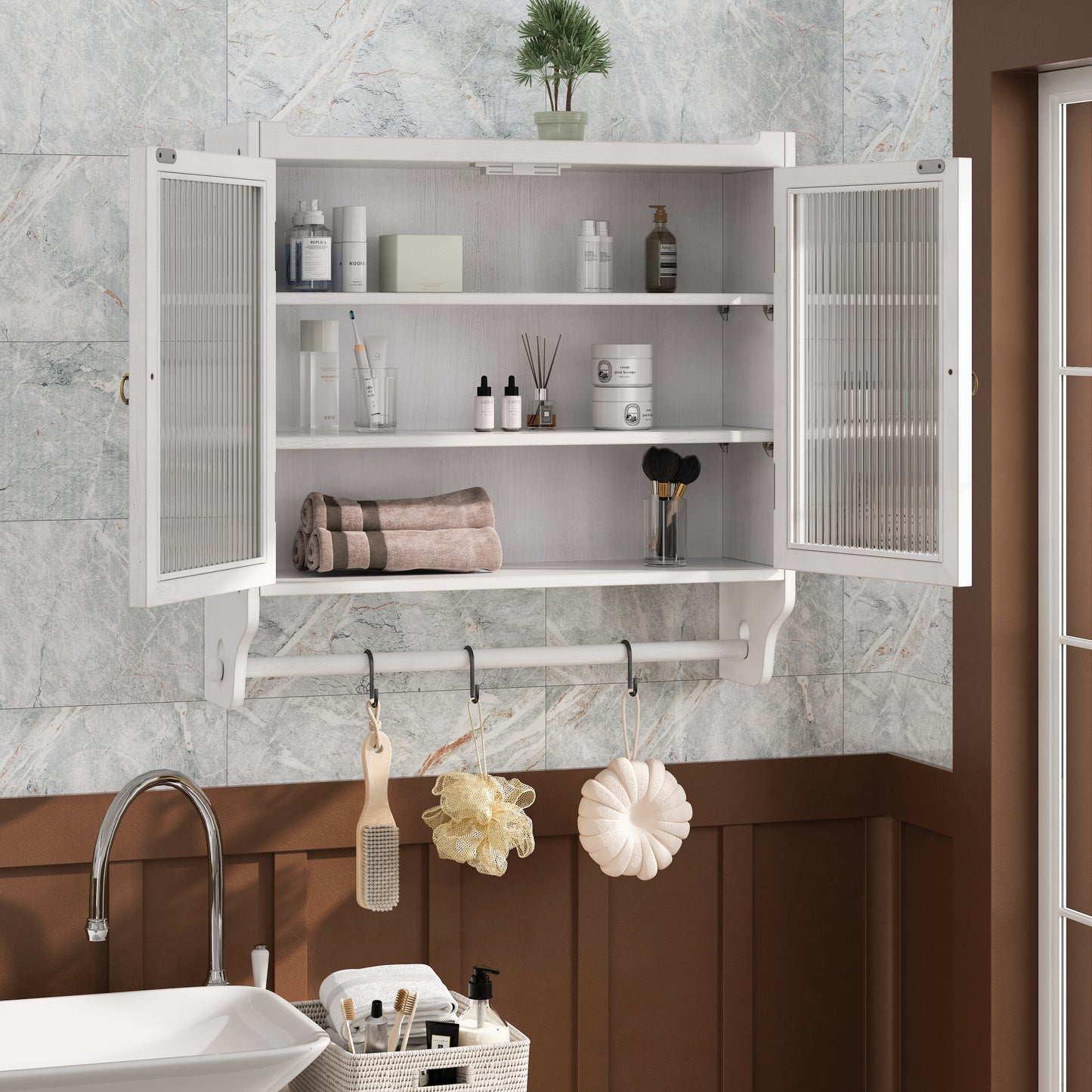 White wallmounted bathroom cabinet with fluted glass doors and metal towel bar