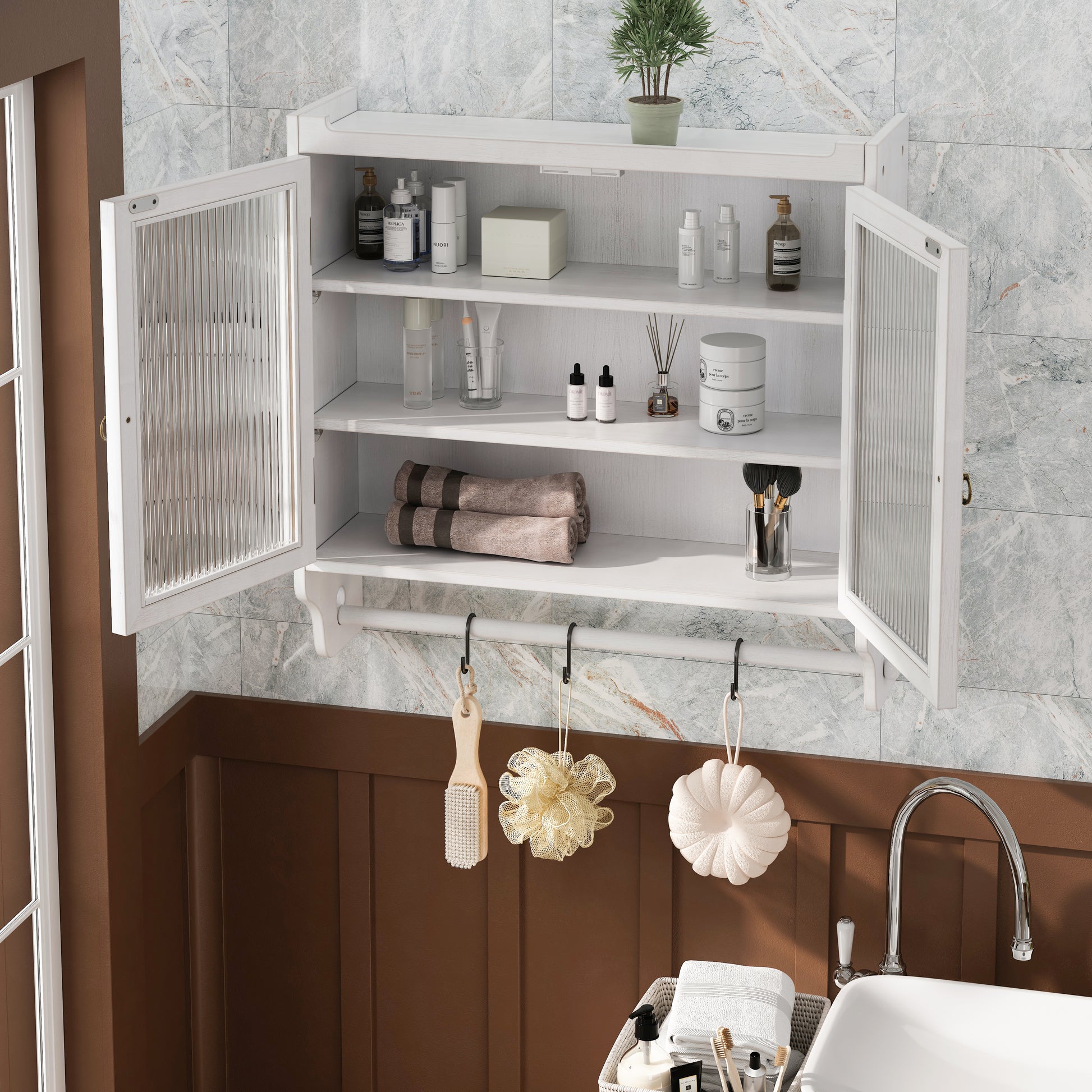 White wooden bathroom cabinet with fluted glass doors and toiletries