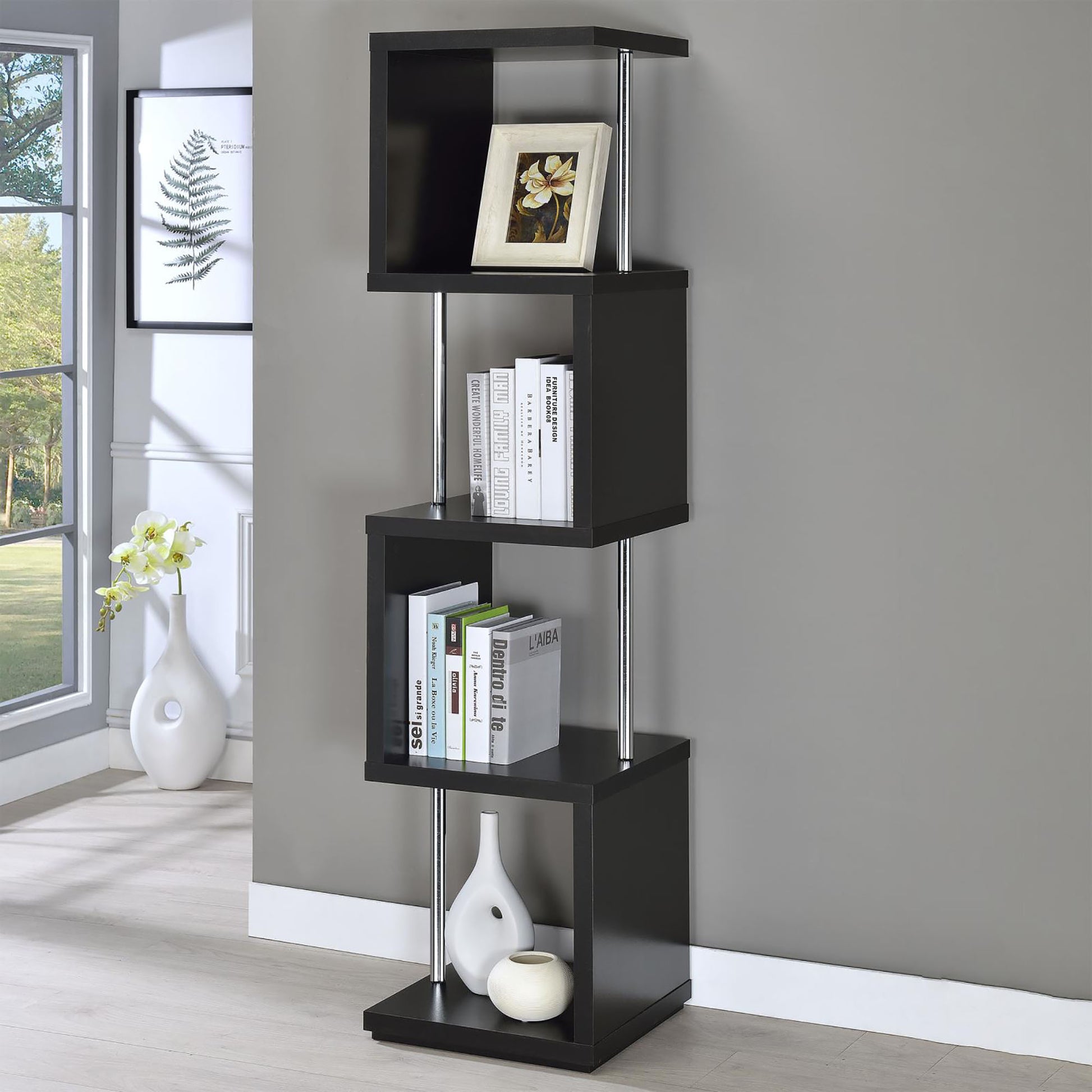 Black modern zigzag bookshelf with chrome accents and books