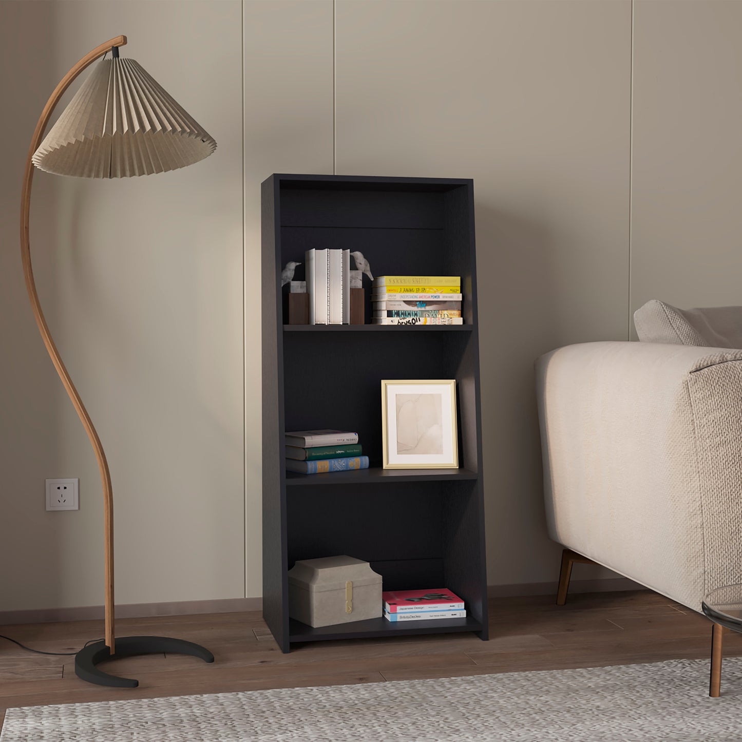 Dark grey modern bookshelf with three shelves holding books and decor