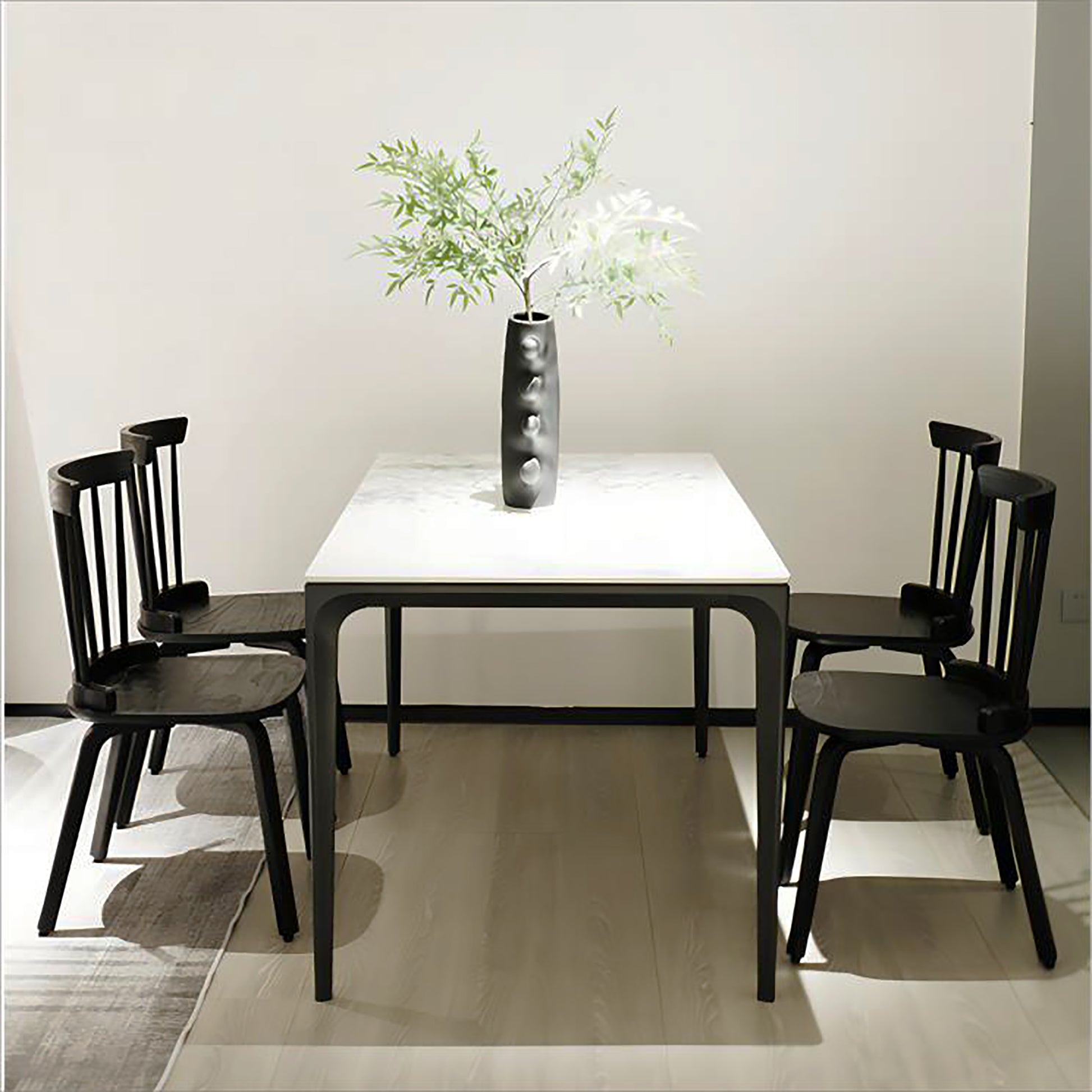 Modern marble top dining table with four black chairs