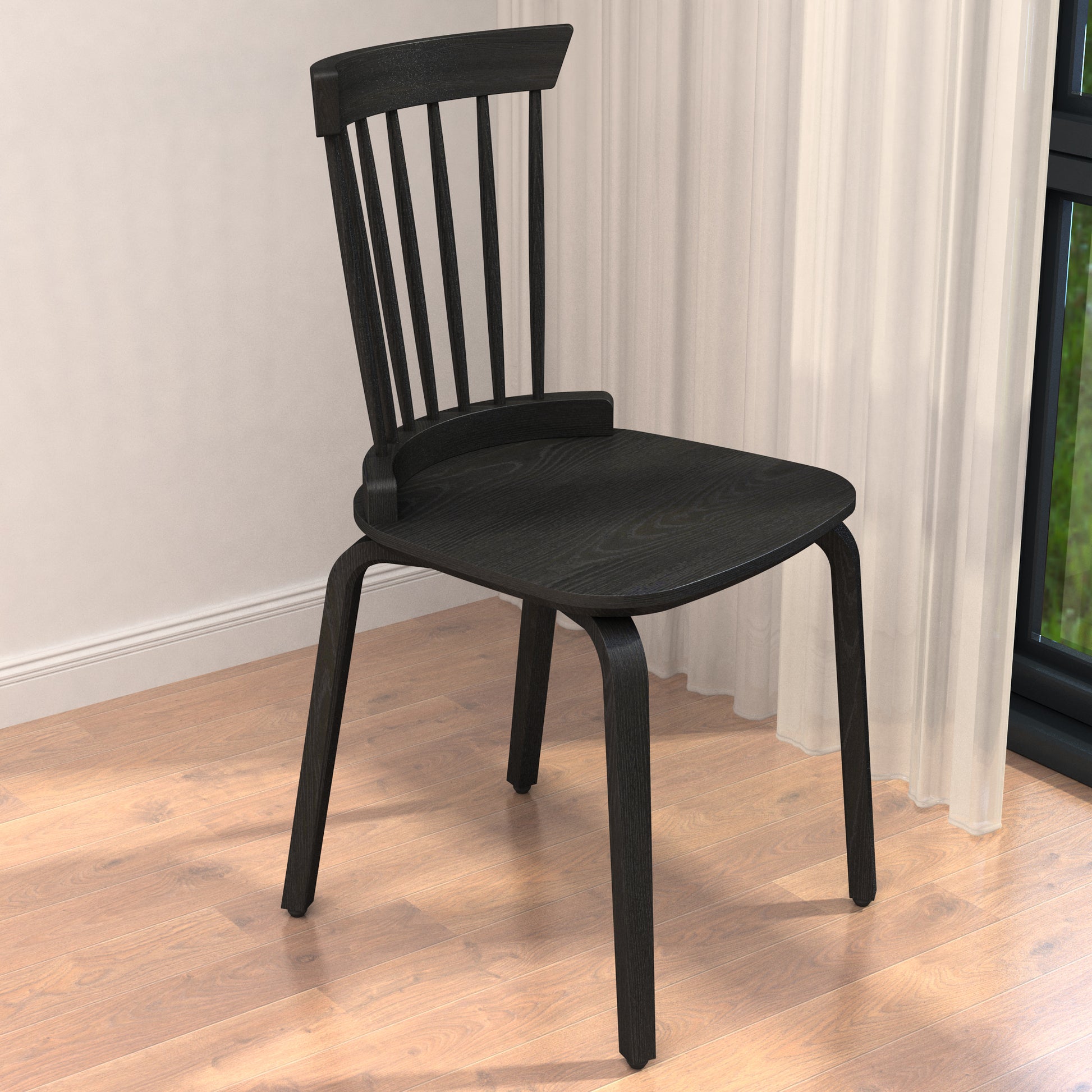 Black wooden spindle back chair with curved seat