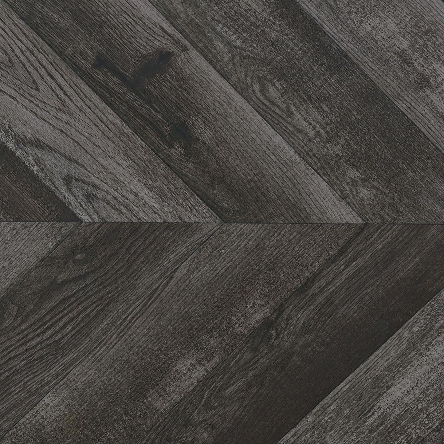 Dark grey wood plank flooring in a chevron pattern