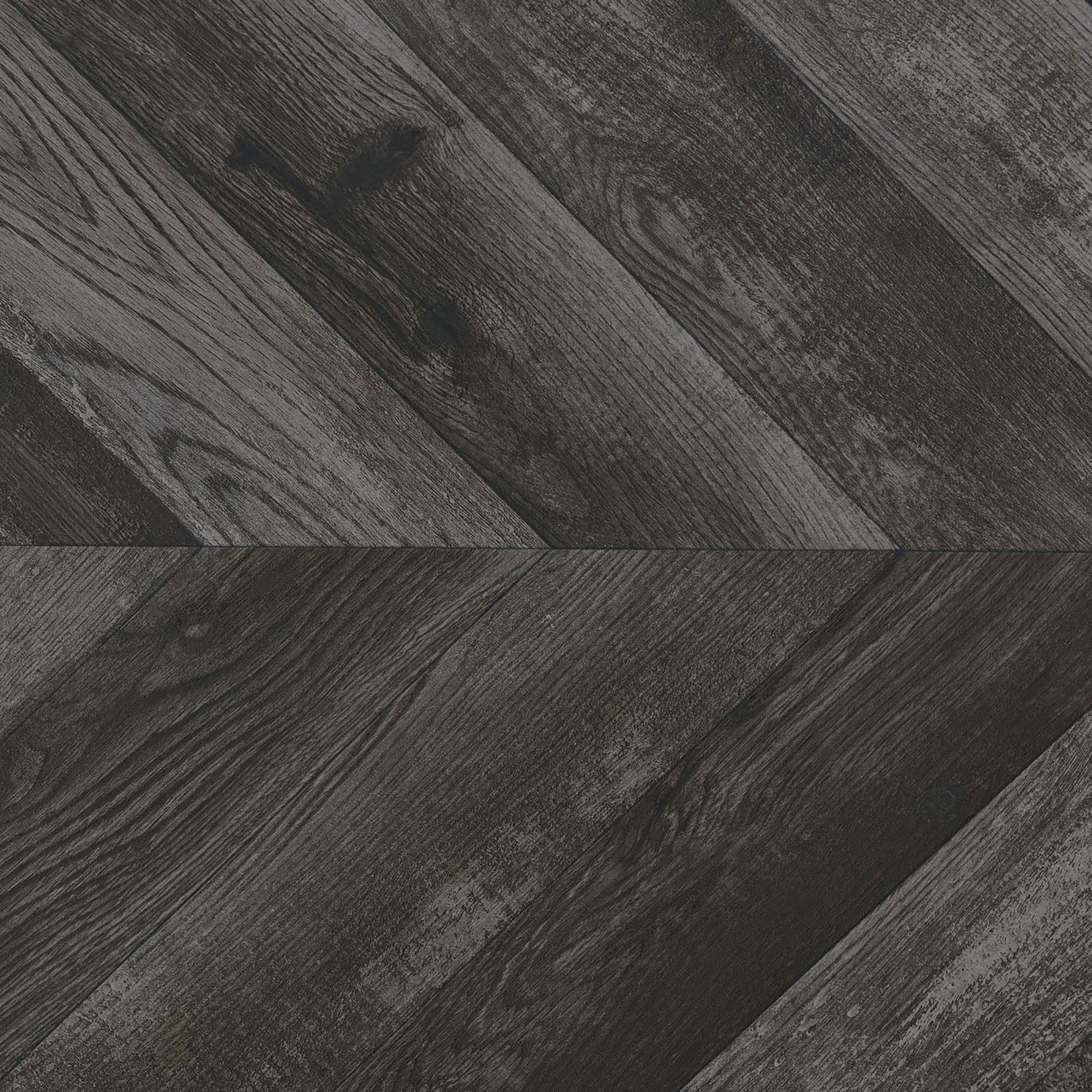 Dark grey wood plank flooring in a chevron pattern