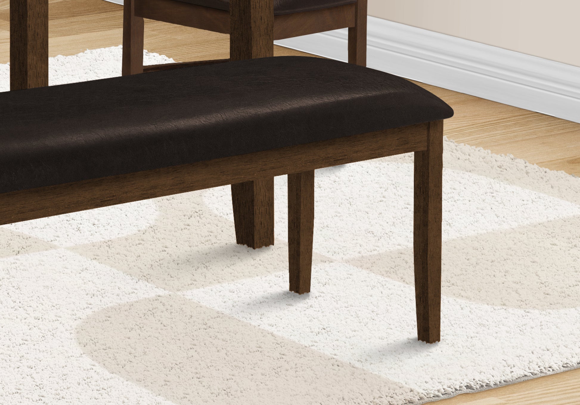 Dark brown upholstered dining bench with wooden legs