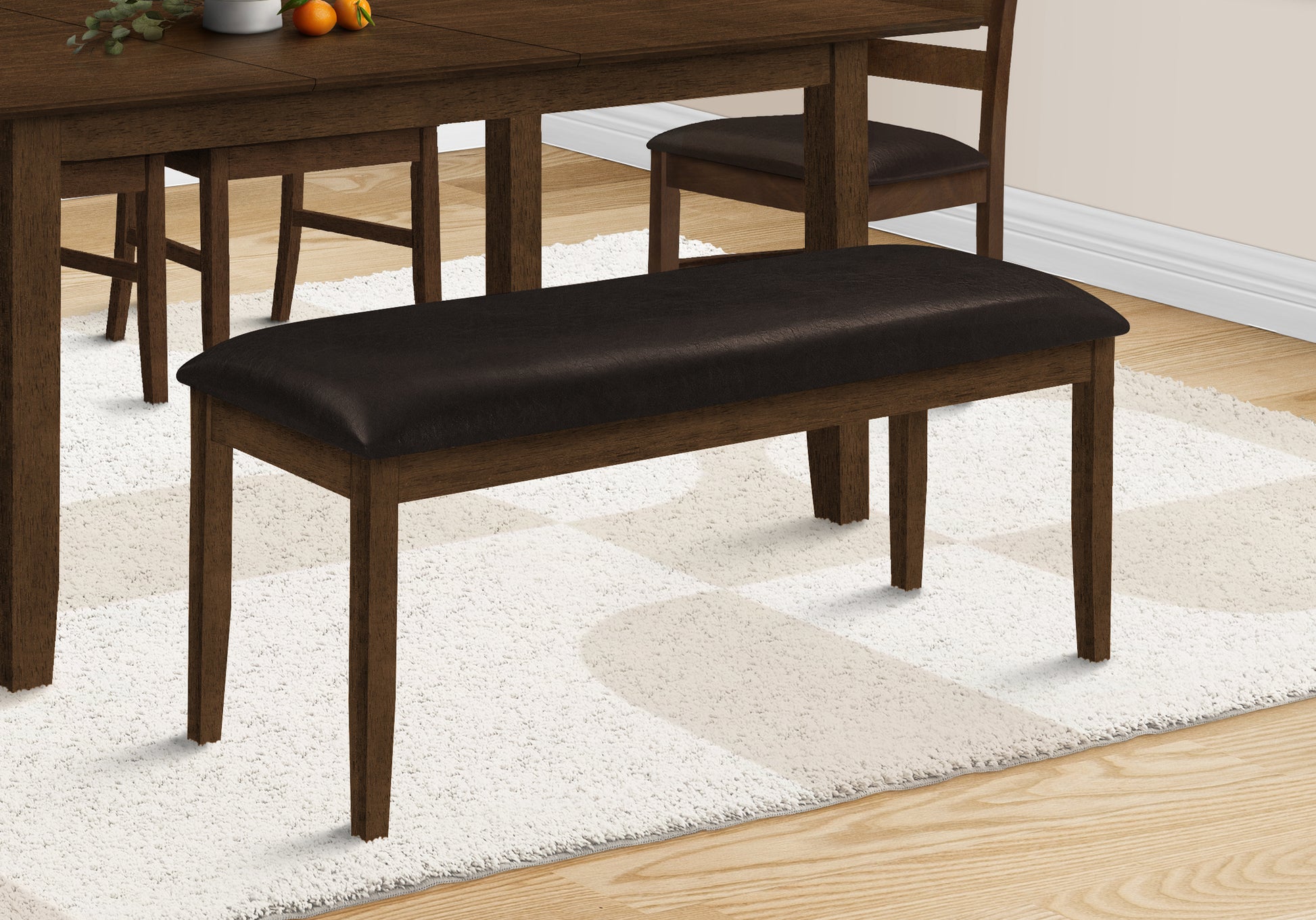 Dark brown faux leather dining bench with wooden frame