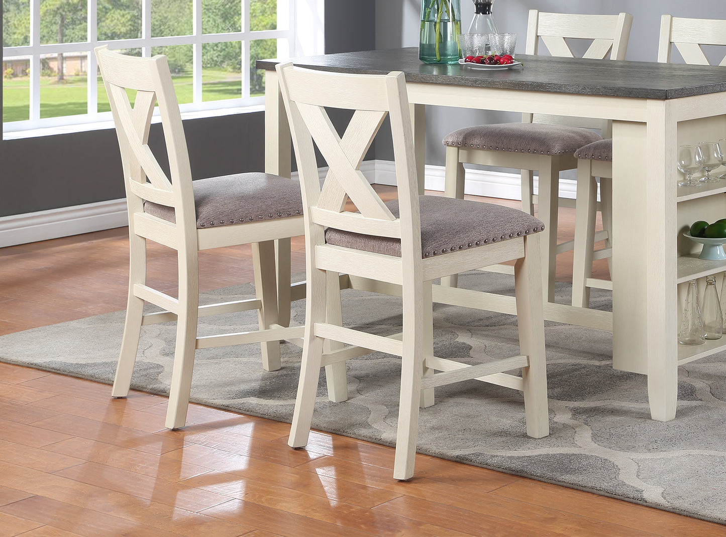 Cream wooden bar stool with grey upholstered seat and Xback design
