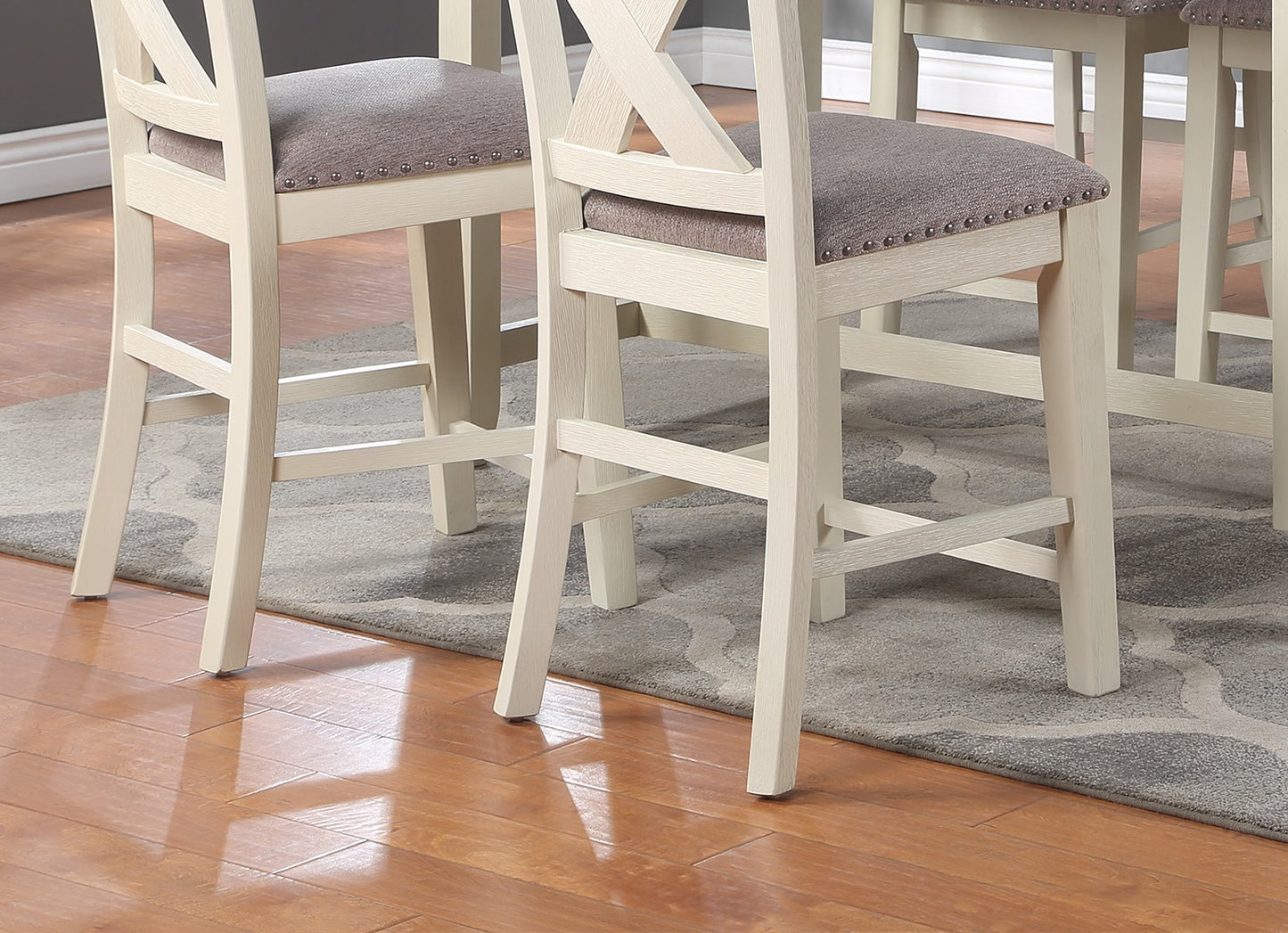 Cream bar stool with grey upholstered seat and crisscross back