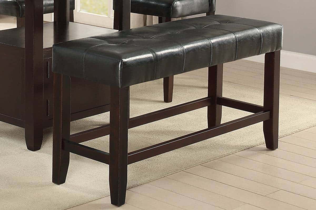 Tufted black leather bar stool with dark wood frame