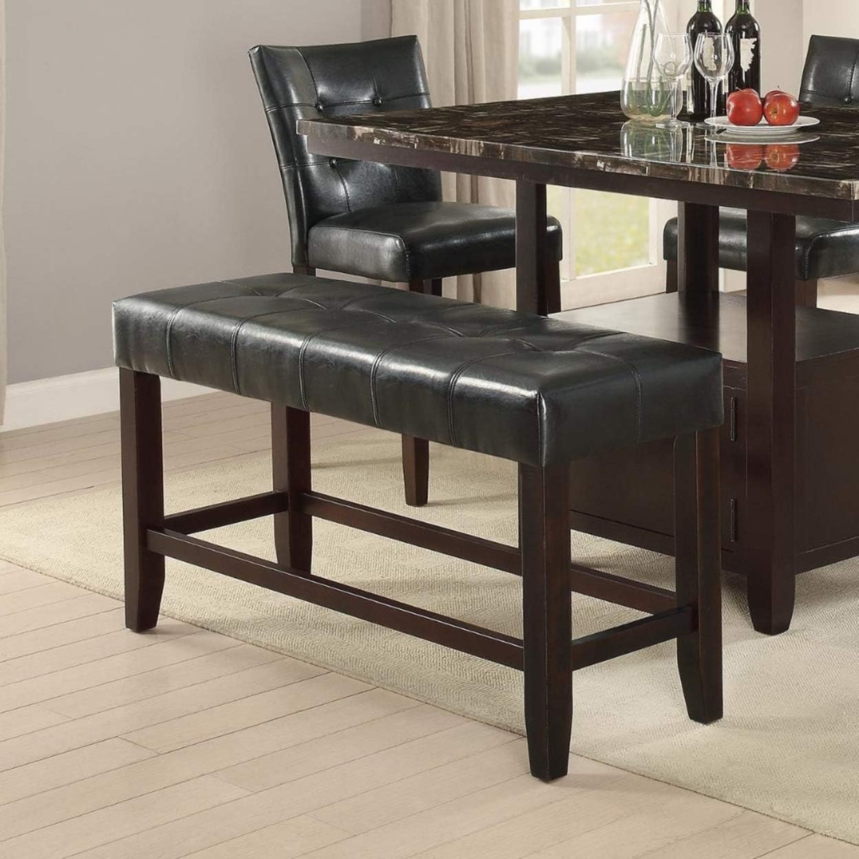 Tufted black faux leather dining bench with dark wood legs