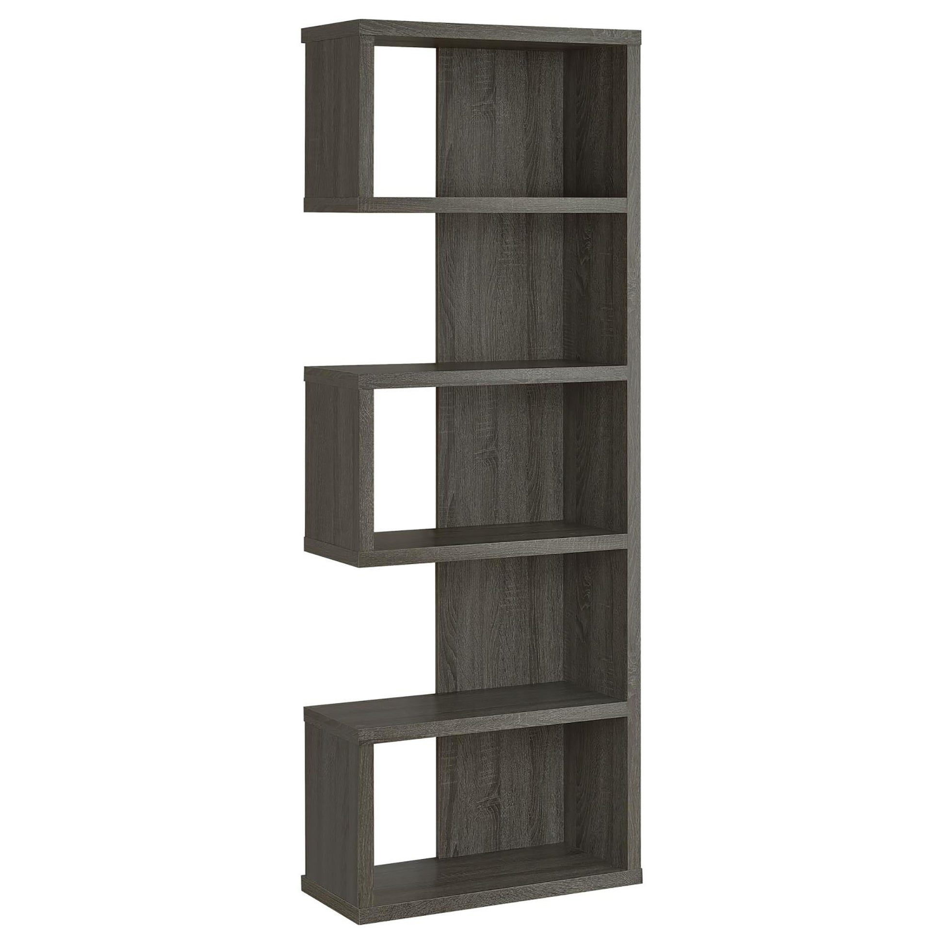 Tall grey wood bookshelf with staggered open cubbies and shelves