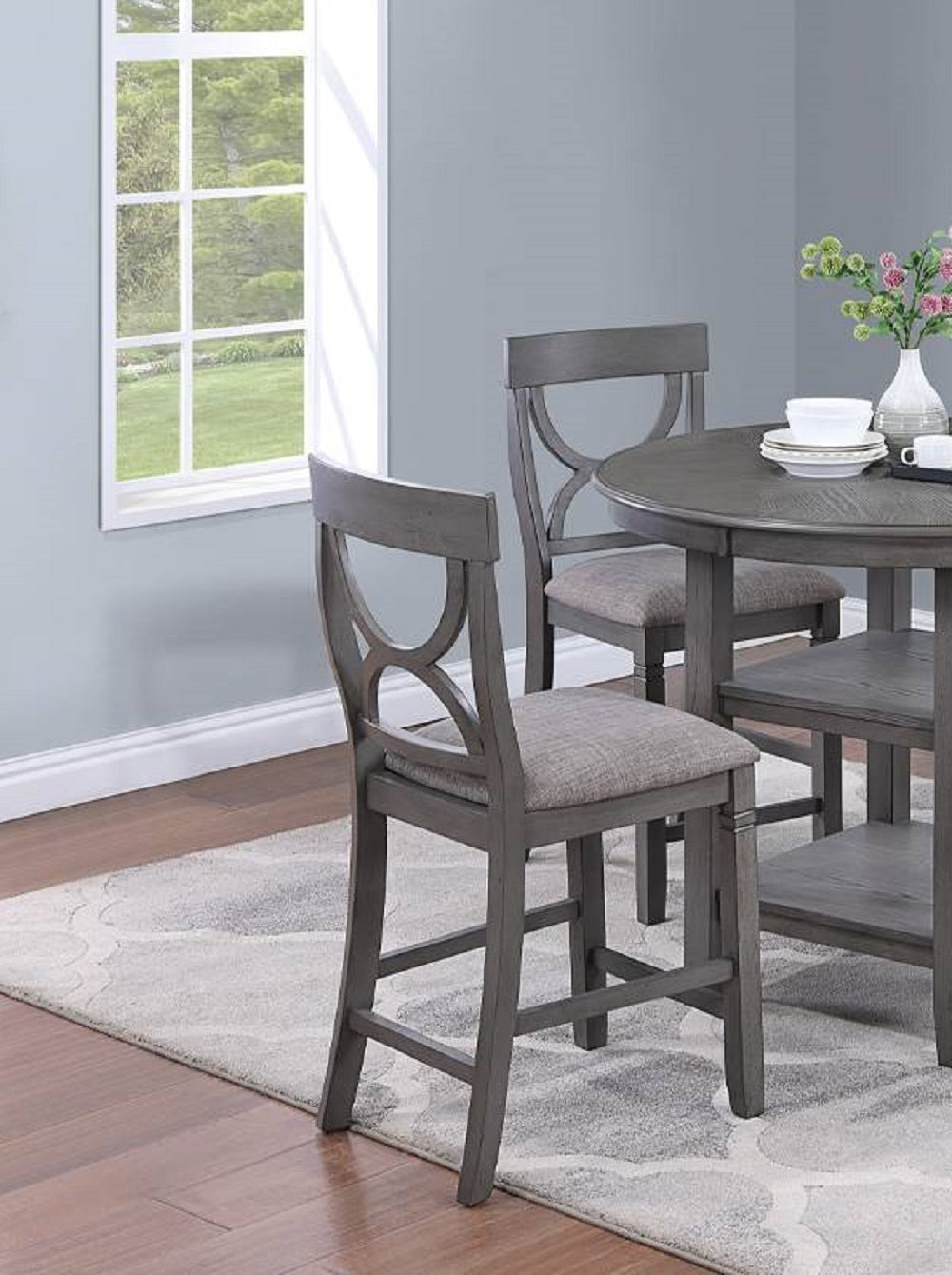 Gray wooden bar stool with upholstered seat and decorative back