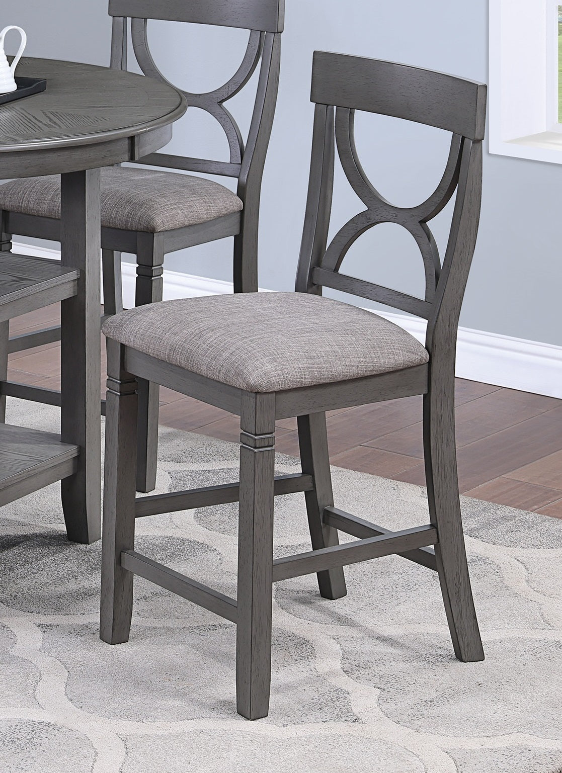 Gray wooden counter stool with upholstered seat and geometric backrest