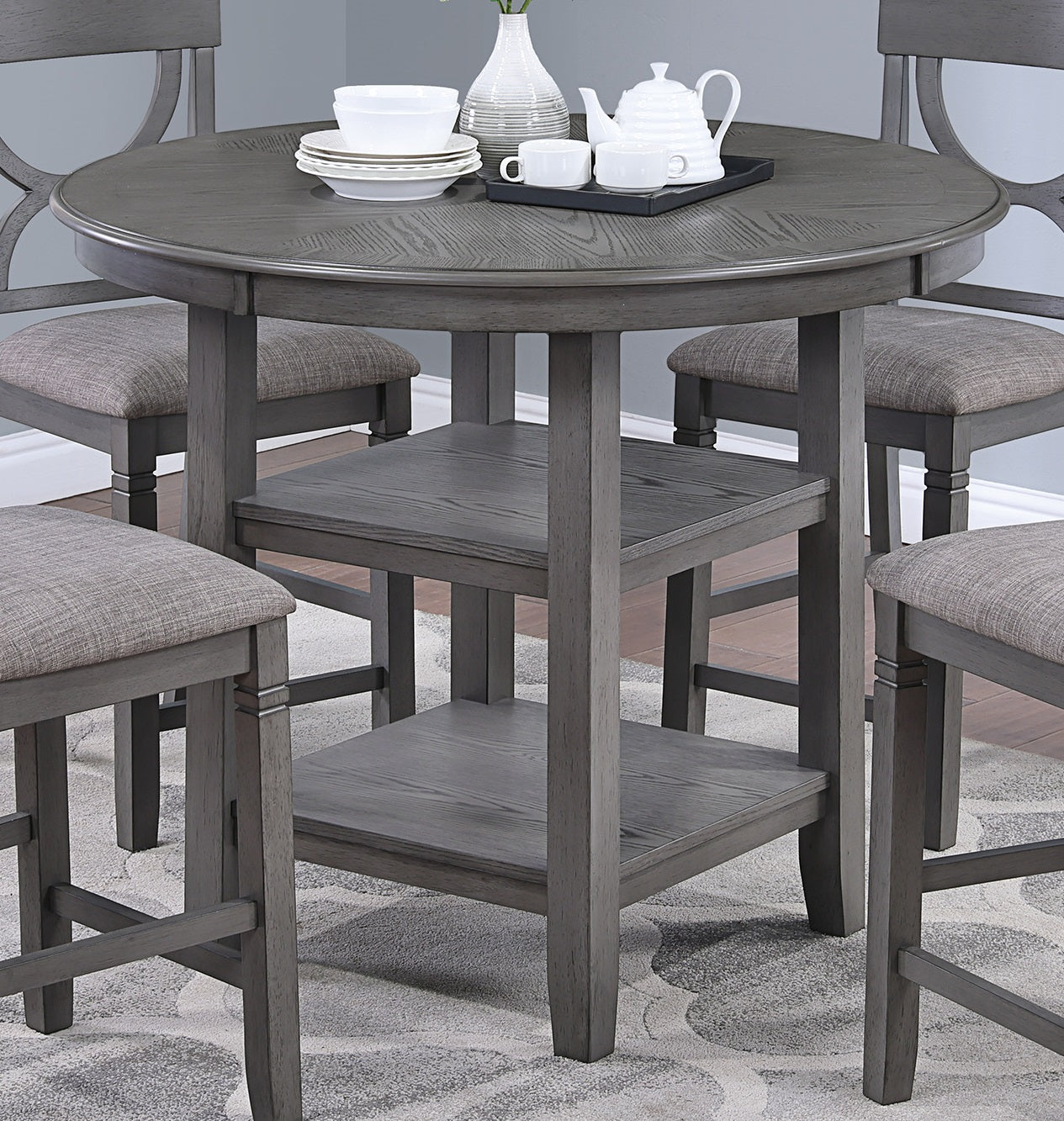 Round gray wood counter height dining table with builtin shelves