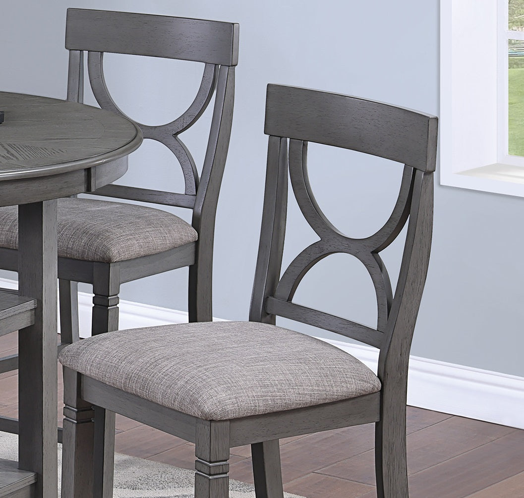 Gray upholstered dining chairs with decorative wooden backs