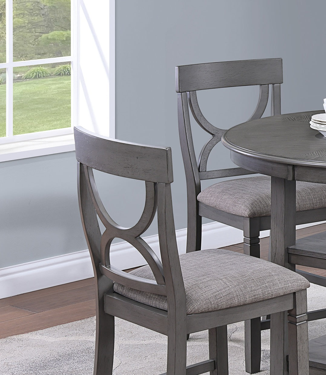 Gray upholstered counter stool with decorative crisscross back