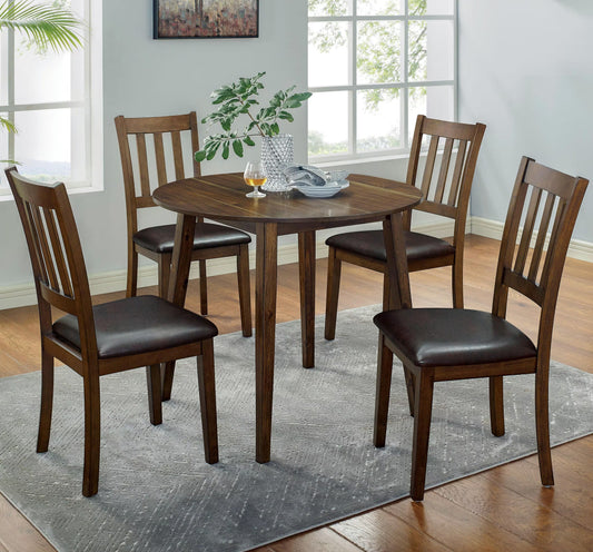 Round oak dining table with four dark brown upholstered chairs